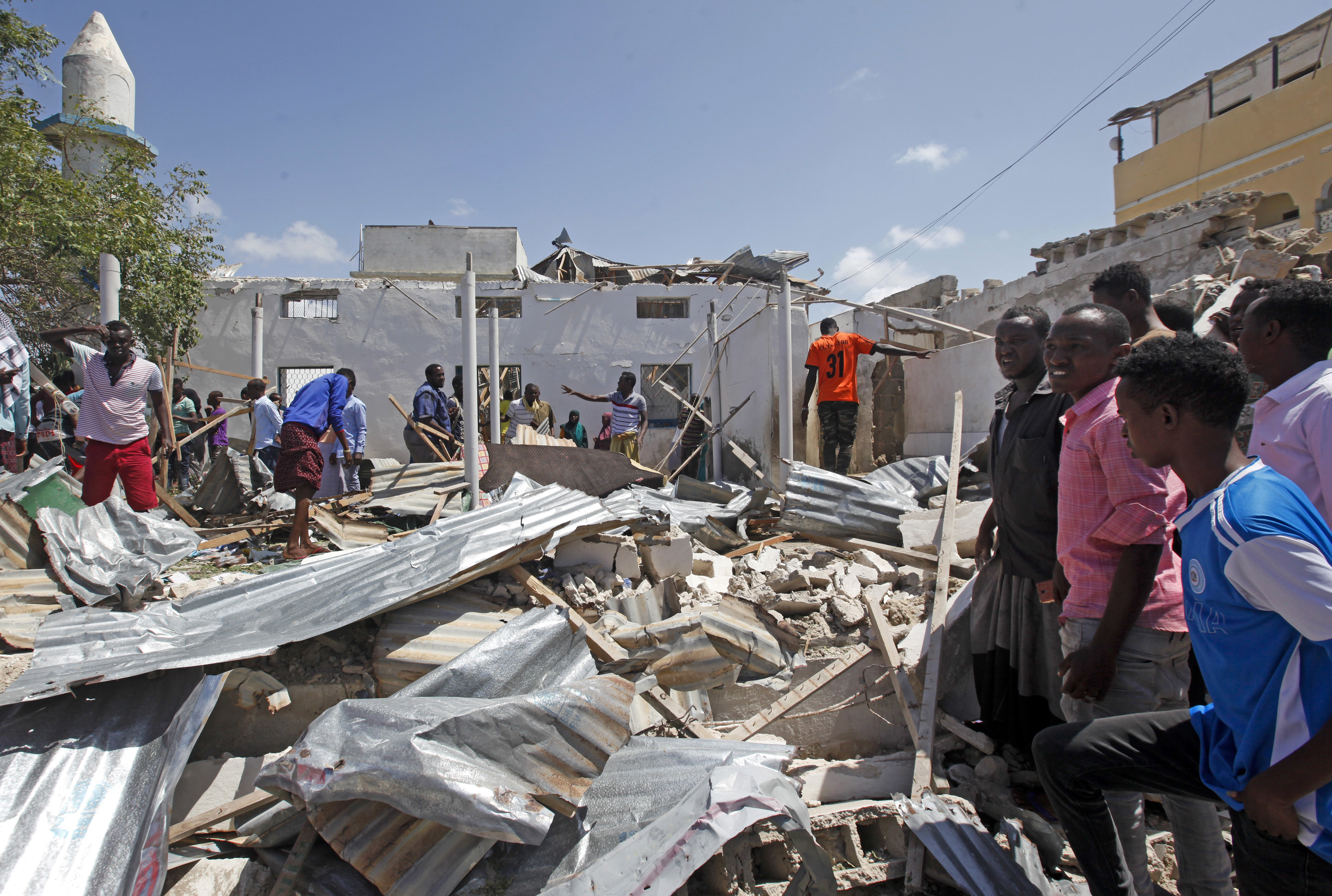 Somalis at the scene of a blast in Mogadishu