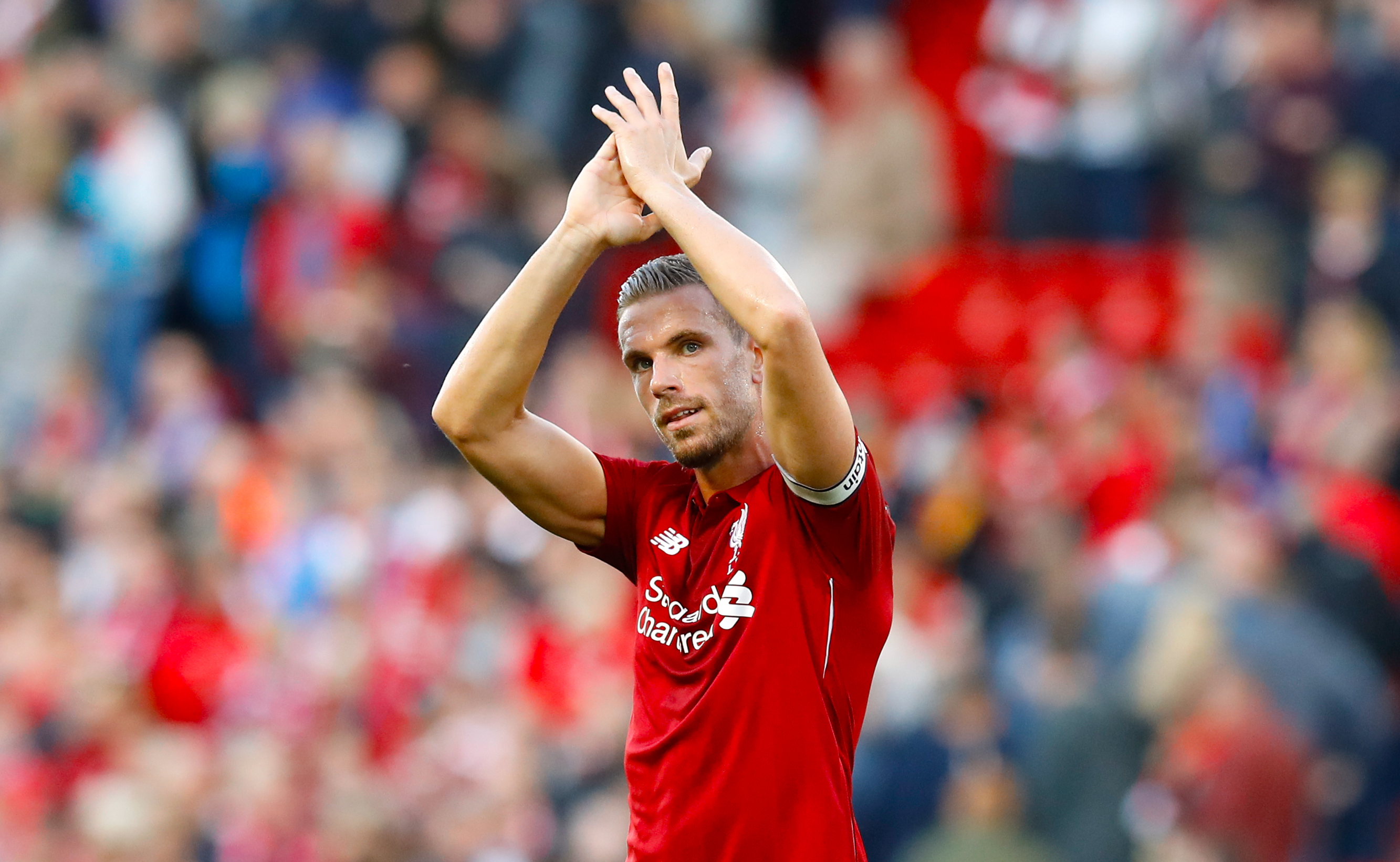 Liverpool's Jordan Henderson applauds the fans after the final whistle