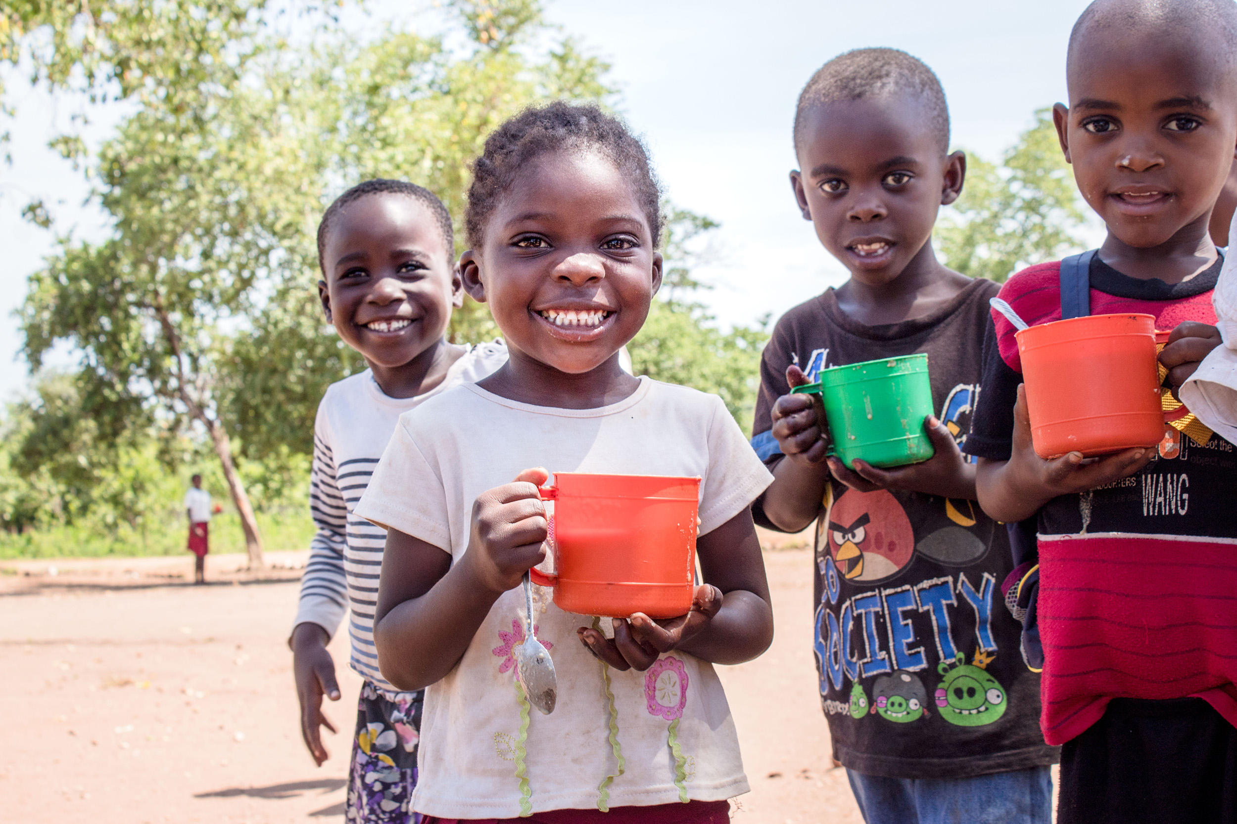 Children in Zambia enjoying porridge