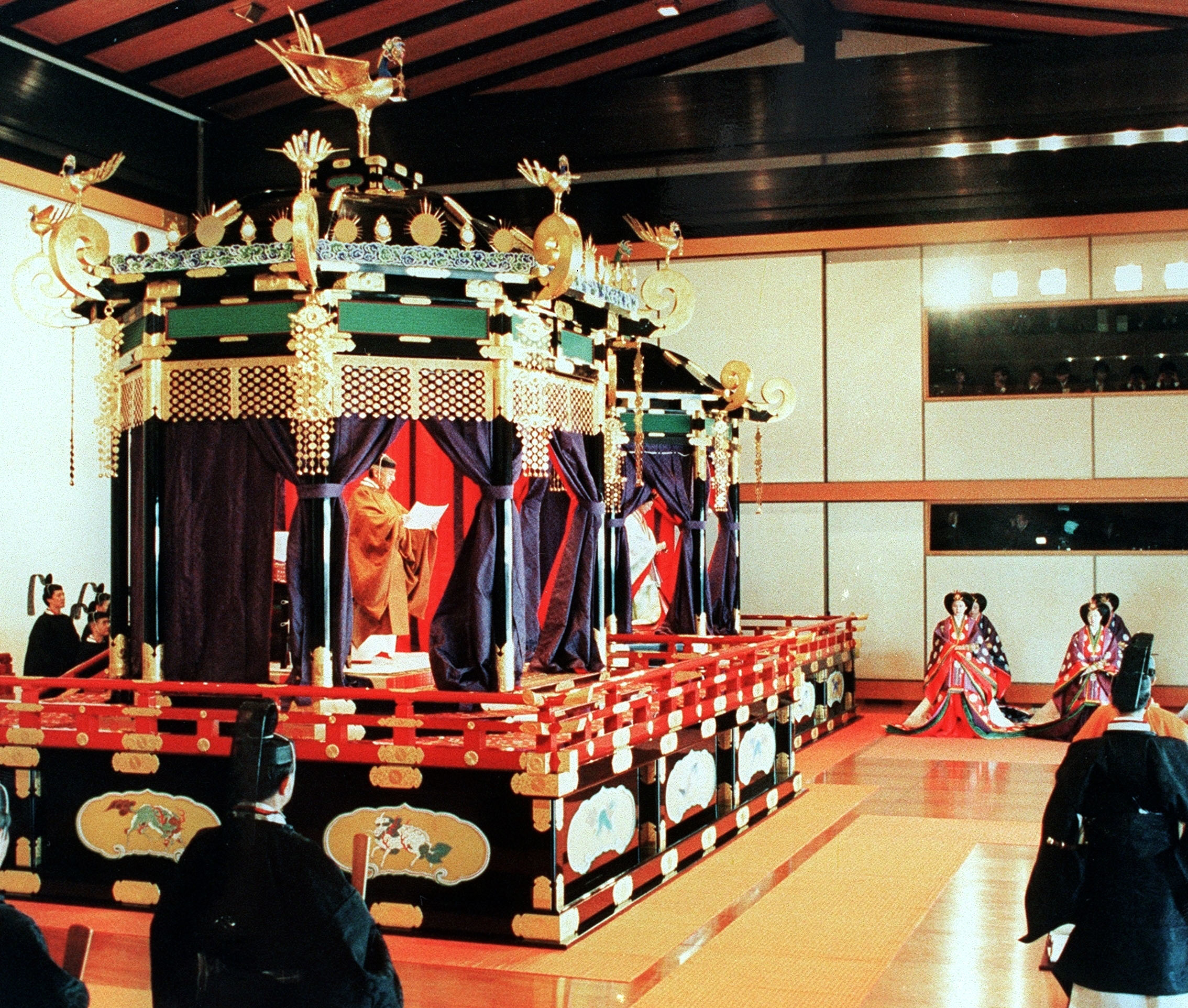 Japan's Emperor Akihito reads an address on the Takamikura throne in 1990