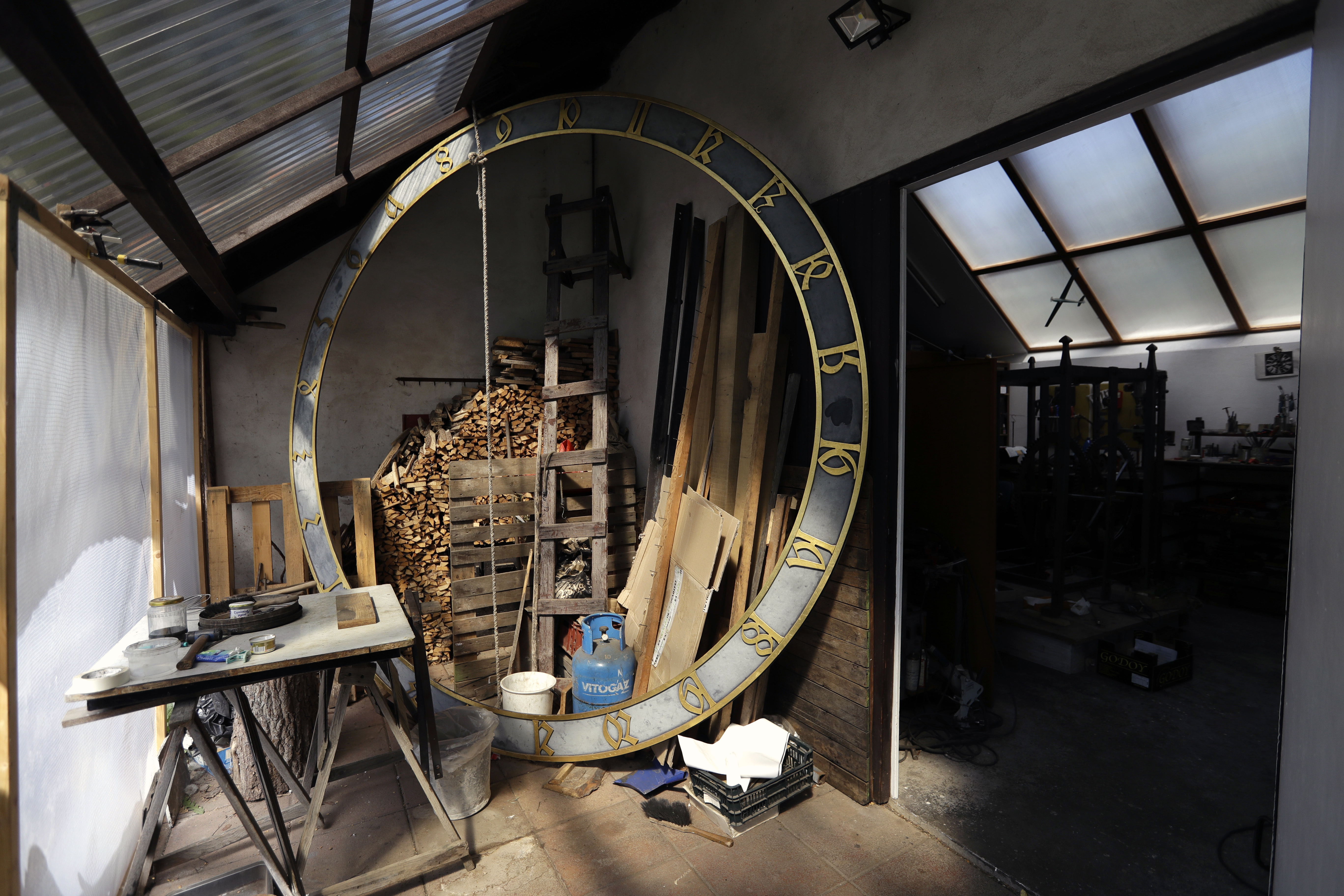 Parts of the famed Prague's medieval astronomical clock are placed at a shop of the clock master Petr Skala in Sadska