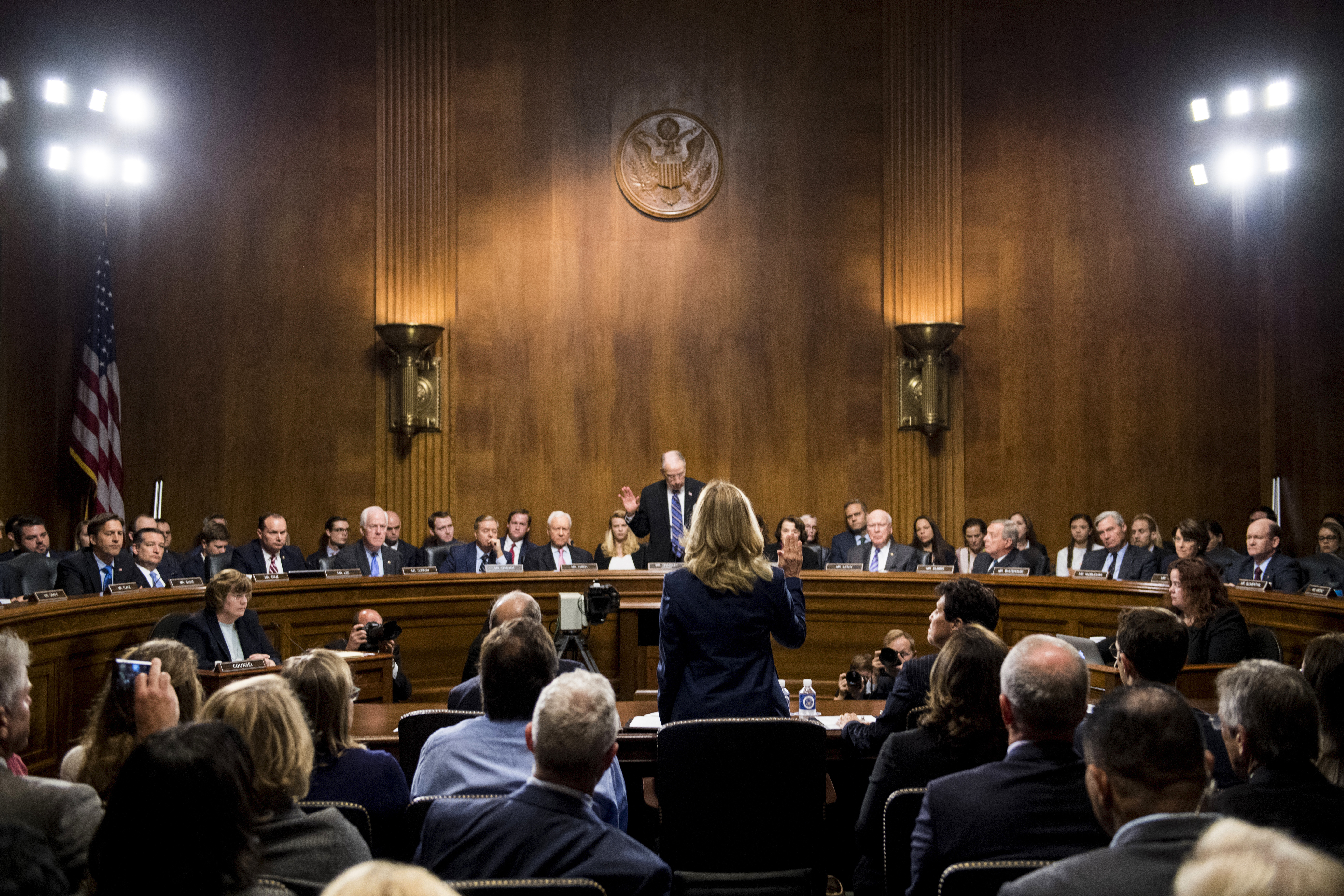 Christine Blasey Ford is sworn in by Senate Judiciary Committee chairman Chuck Grassley 