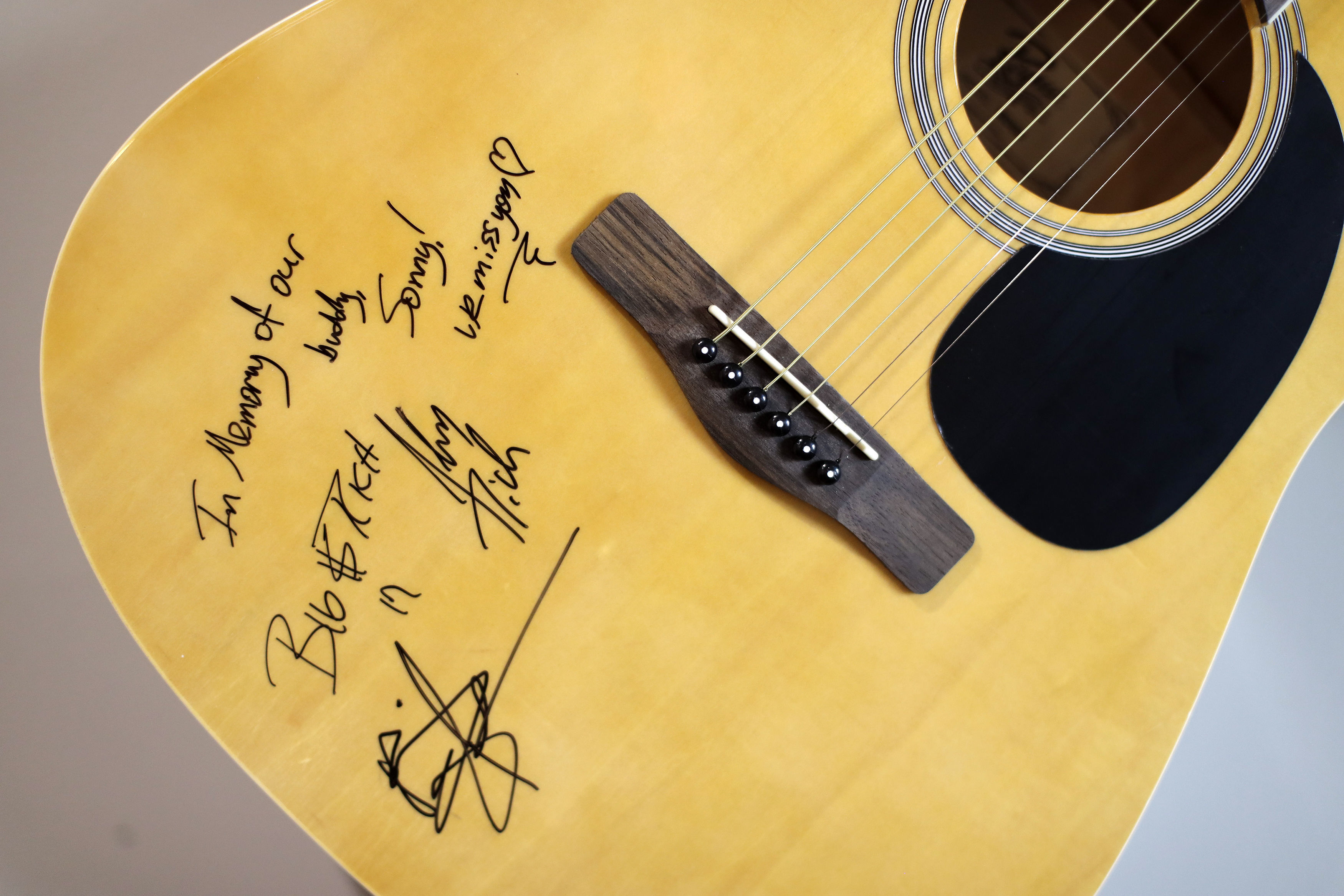 A guitar autographed by the country music duo Big and Rich