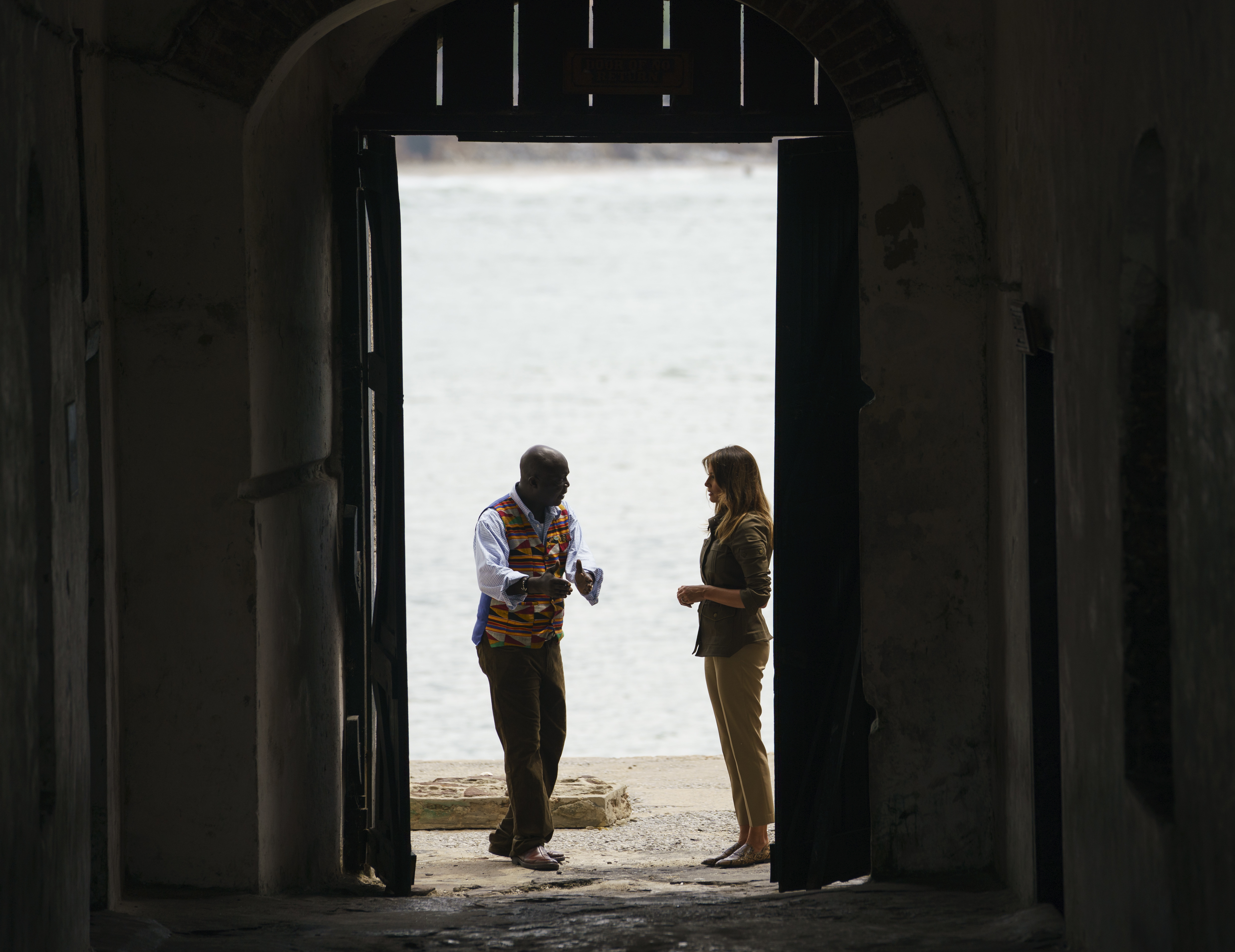 Melania Trump looks up as she walks through the Door Of No Return with Cape Coast Castle museum educator Kwesi Essel-Blankson