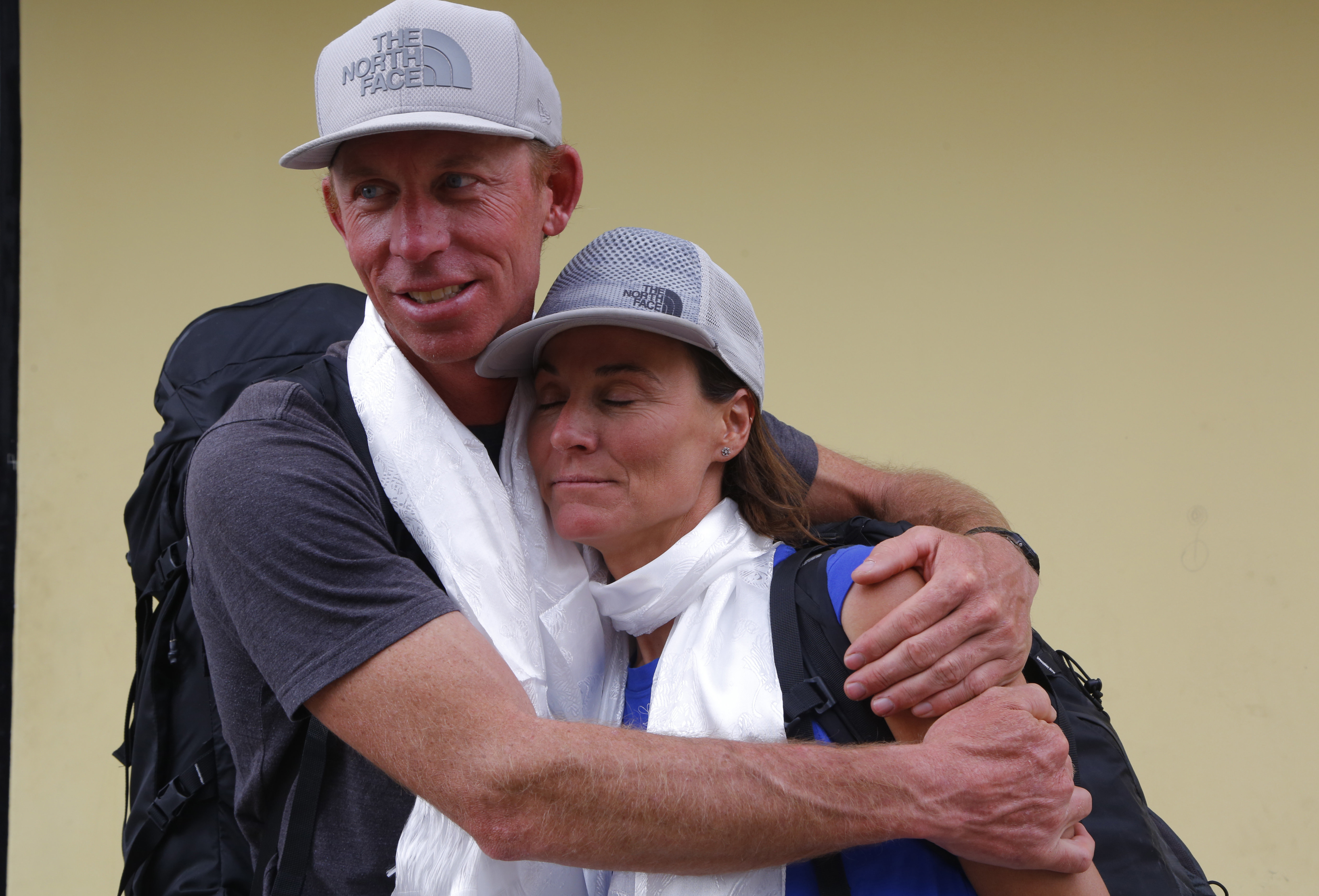 James Morrison hugs Hilaree Nelson as the pair arrive in Kathmandu 