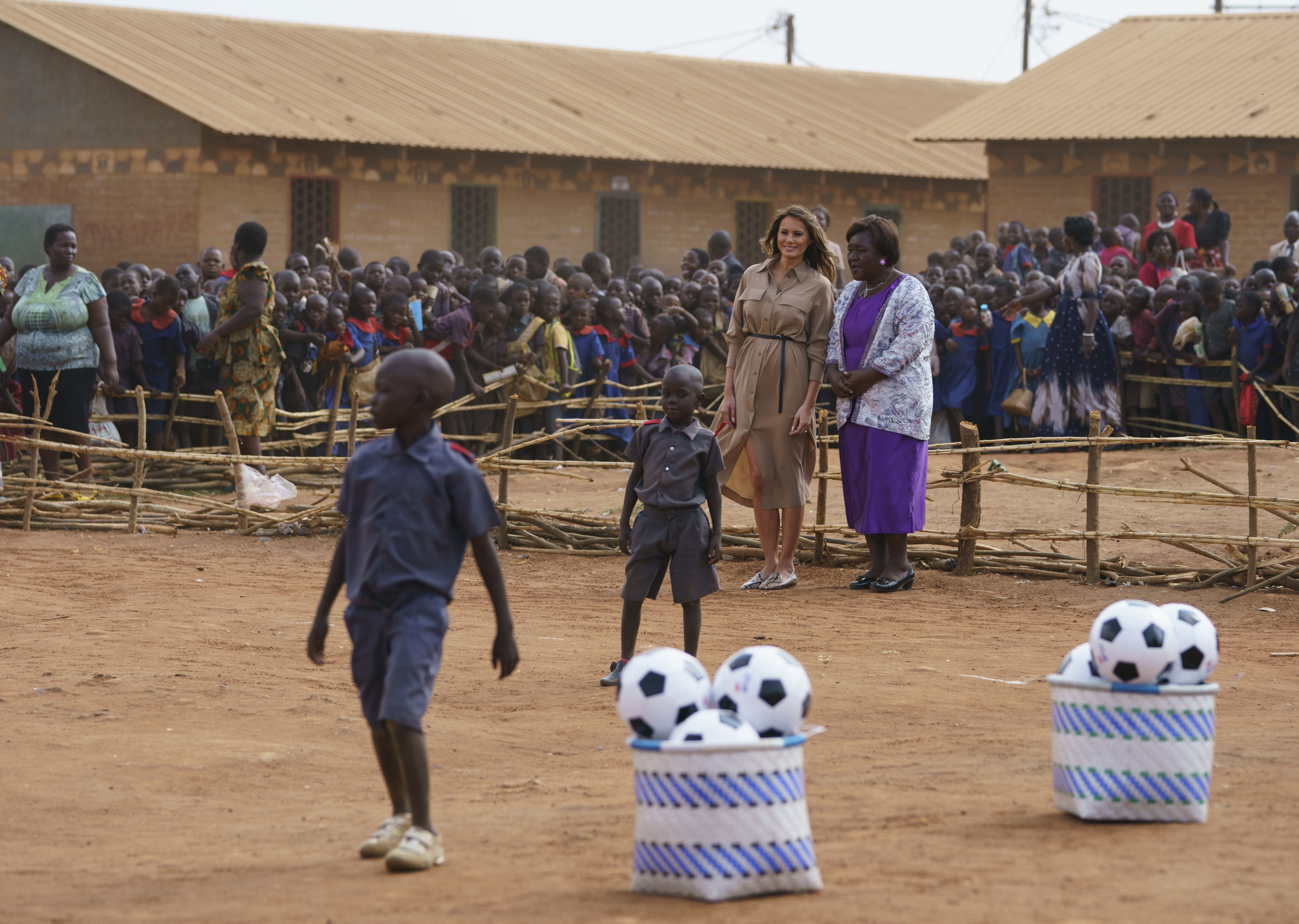 Melania Trump watches children play football at Chipala Primary School  in Malawi