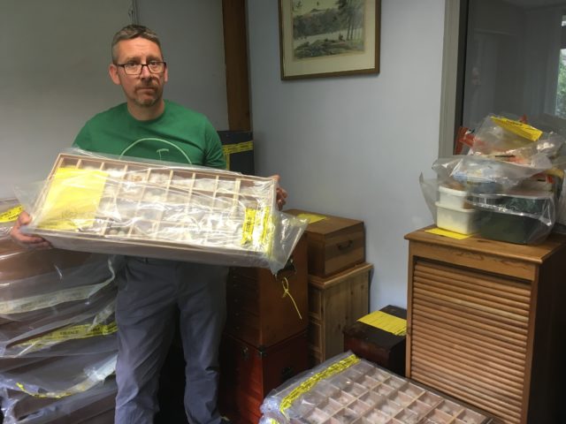 RSPB senior investigations officer Mark Thomas with some of the 5,266 rare bird eggs seized from Daniel Lingham. Lingham has admitted five offences under the Wildlife and Countryside Act 1981. (RSPB/ PA)