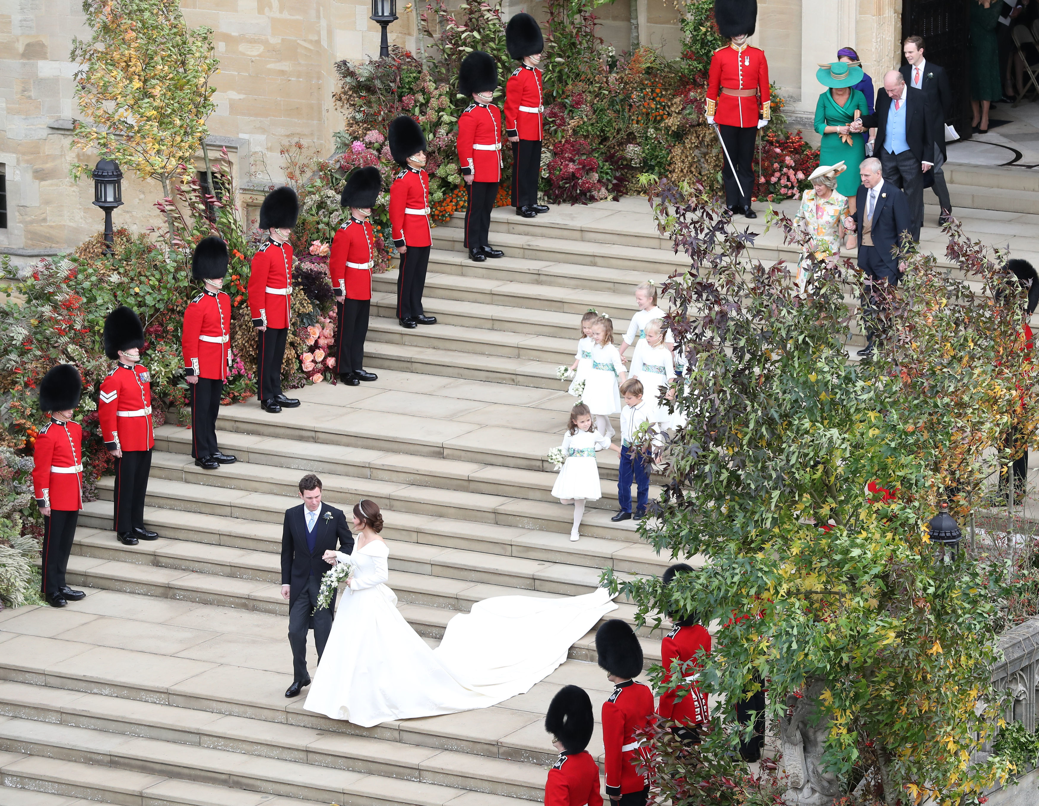 Princess Eugenie and her new husband Jack Brooksbank walk down the West Steps
