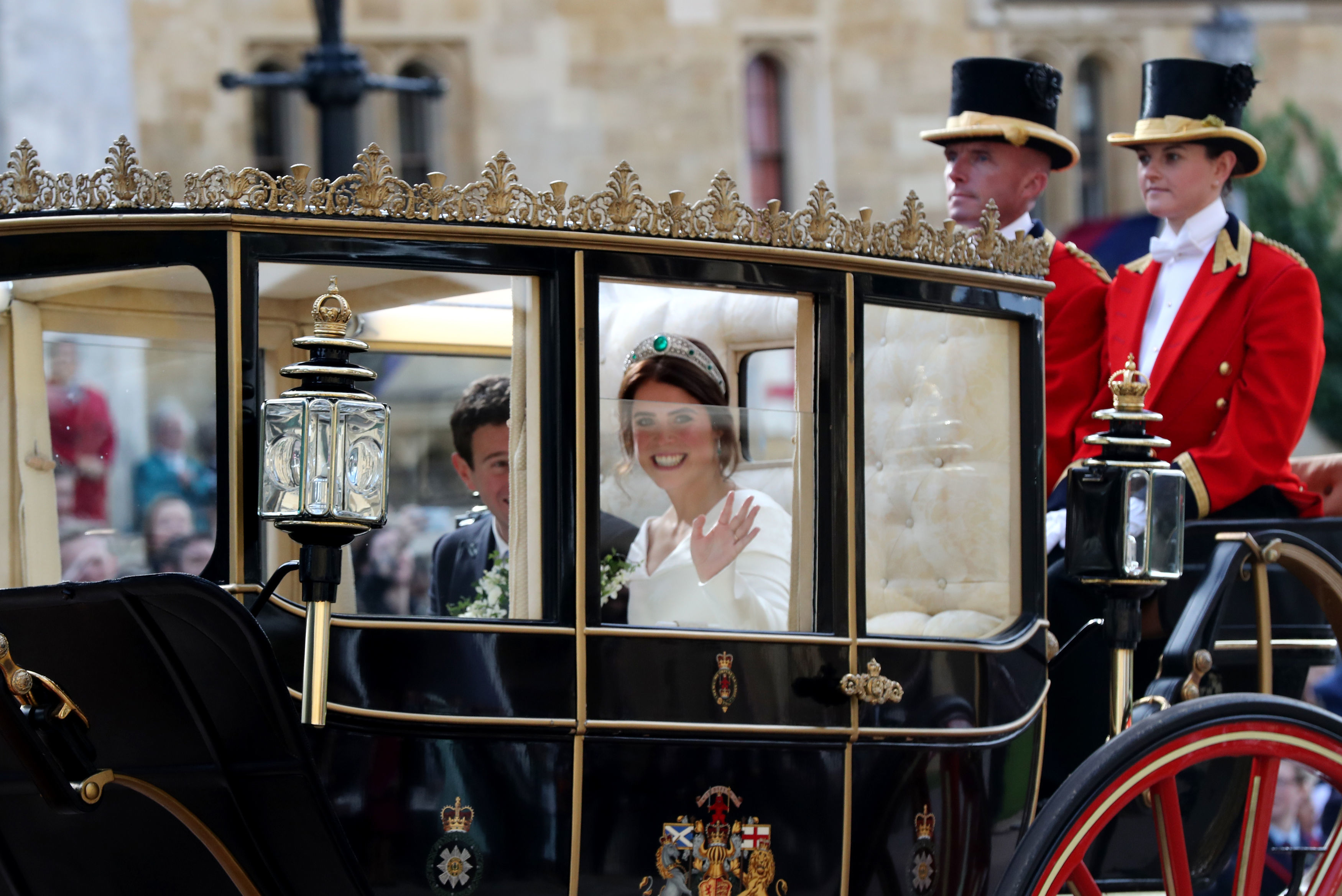 Princess Eugenie waves from the carriage 