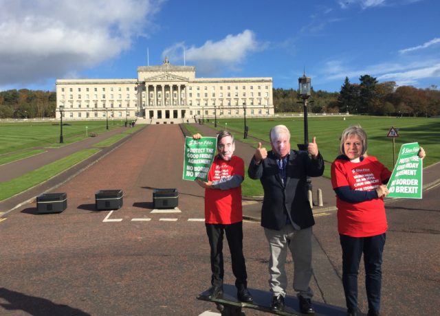 Sinn Fein activists demonstrate outside Stormont