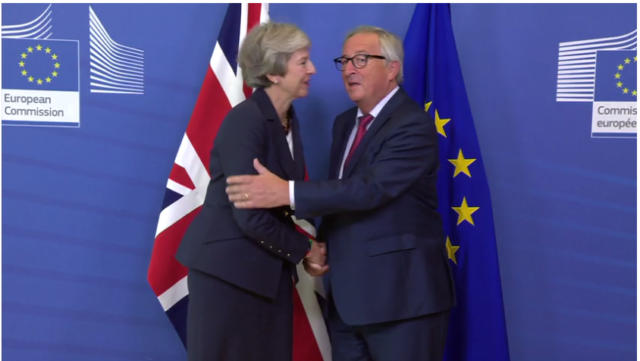 Theresa May was greeted in Brussels with a kiss from European Commission president Jean-Claude Juncker