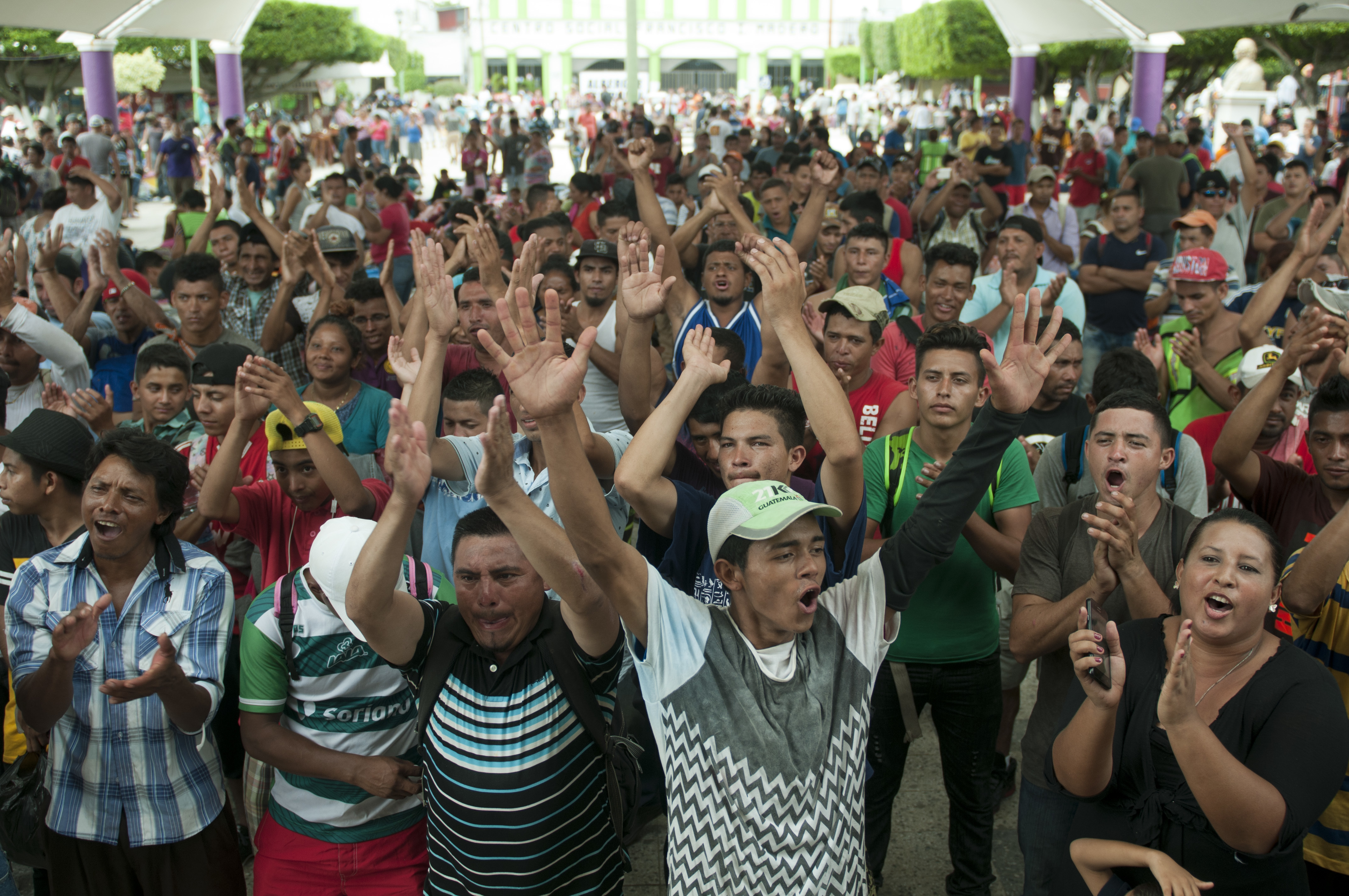 A group of Central American migrants gather in the central park of Ciudad Hidlago