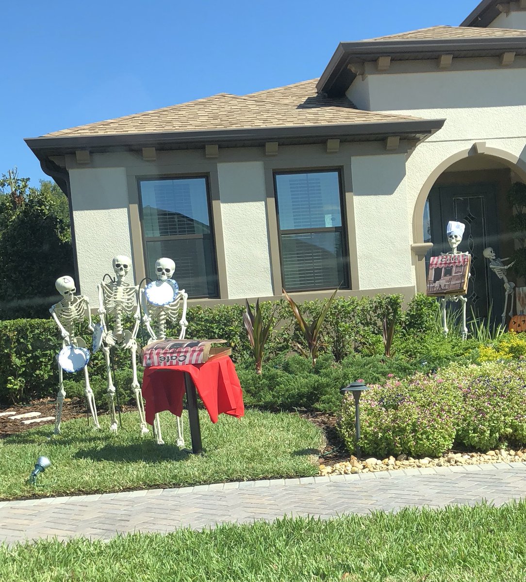 Some skeletons having a pizza party