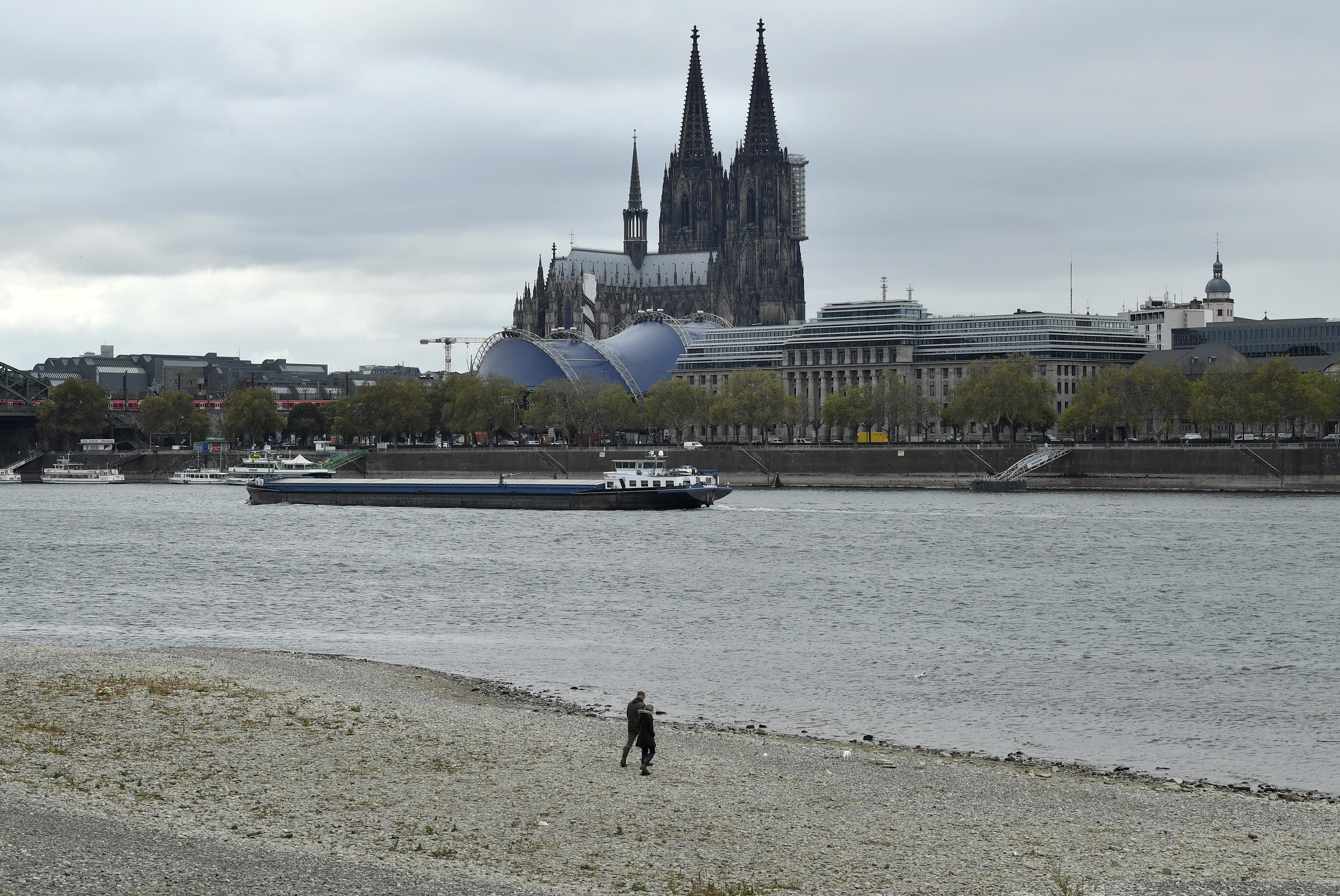A ship on the Rhine River passes the cathedral in Cologne