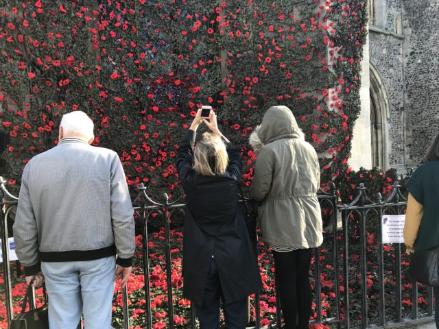 Fire fighters hung the cascade of poppies from the 90ft church tower. (Sam Russell/ PA)