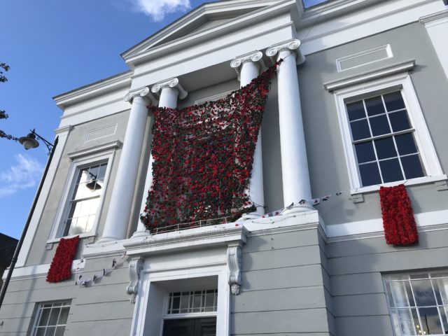 More than 21,000 handmade poppies adorn the church tower and the rest are on Sudbury's town hall, pictured. (Sam Russell/ PA)