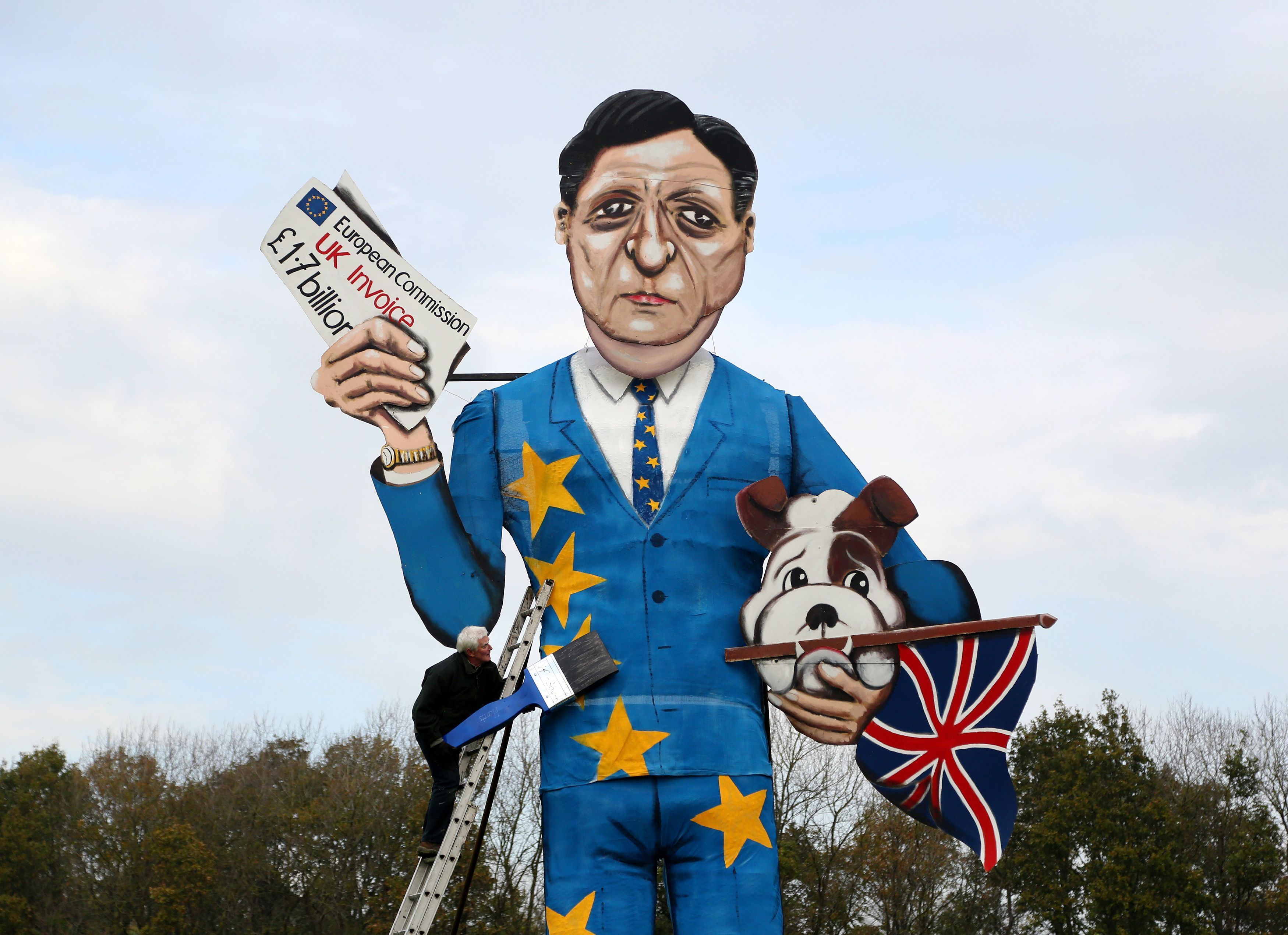 Artist Frank Shepherd puts the final touches to the 2014 Eden Bridge Bonfire Society celebrity guy which has been unveiled as Jose Manuel Barroso, the exiting President of the European Commission