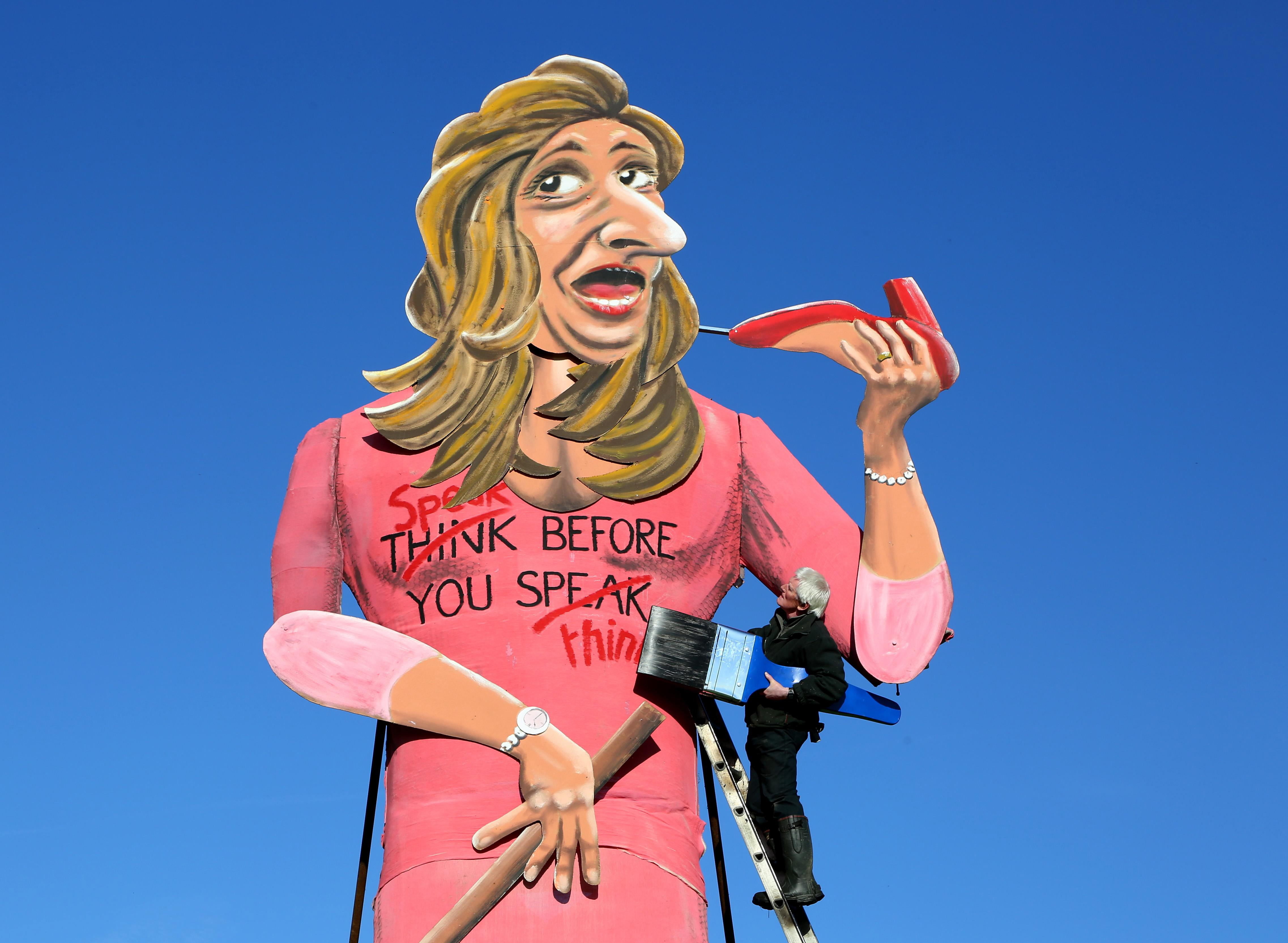 Artist Frank Shepherd puts the final touches to his creation of Katie Hopkins who was unveiled as 2013's Edenbridge Bonfire Society celebrity guy during a photocall in Edenbridge, Kent