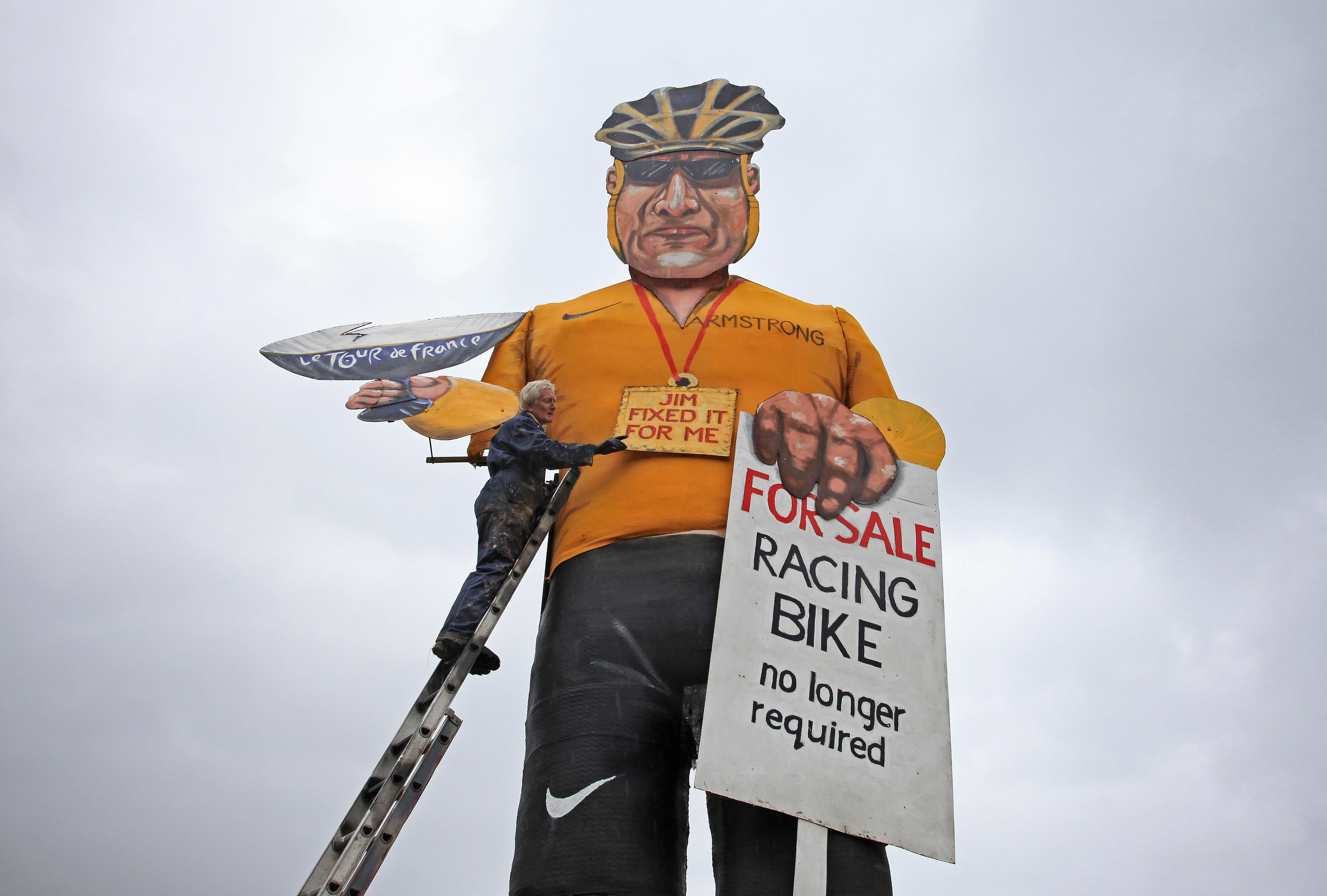 Artist Frank Shepherd puts the final touches to his creation of Lance Armstrong who was unveiled as 2012's Edenbridge Bonfire Society celebrity guy during a photocall in Edenbridge, Kent 