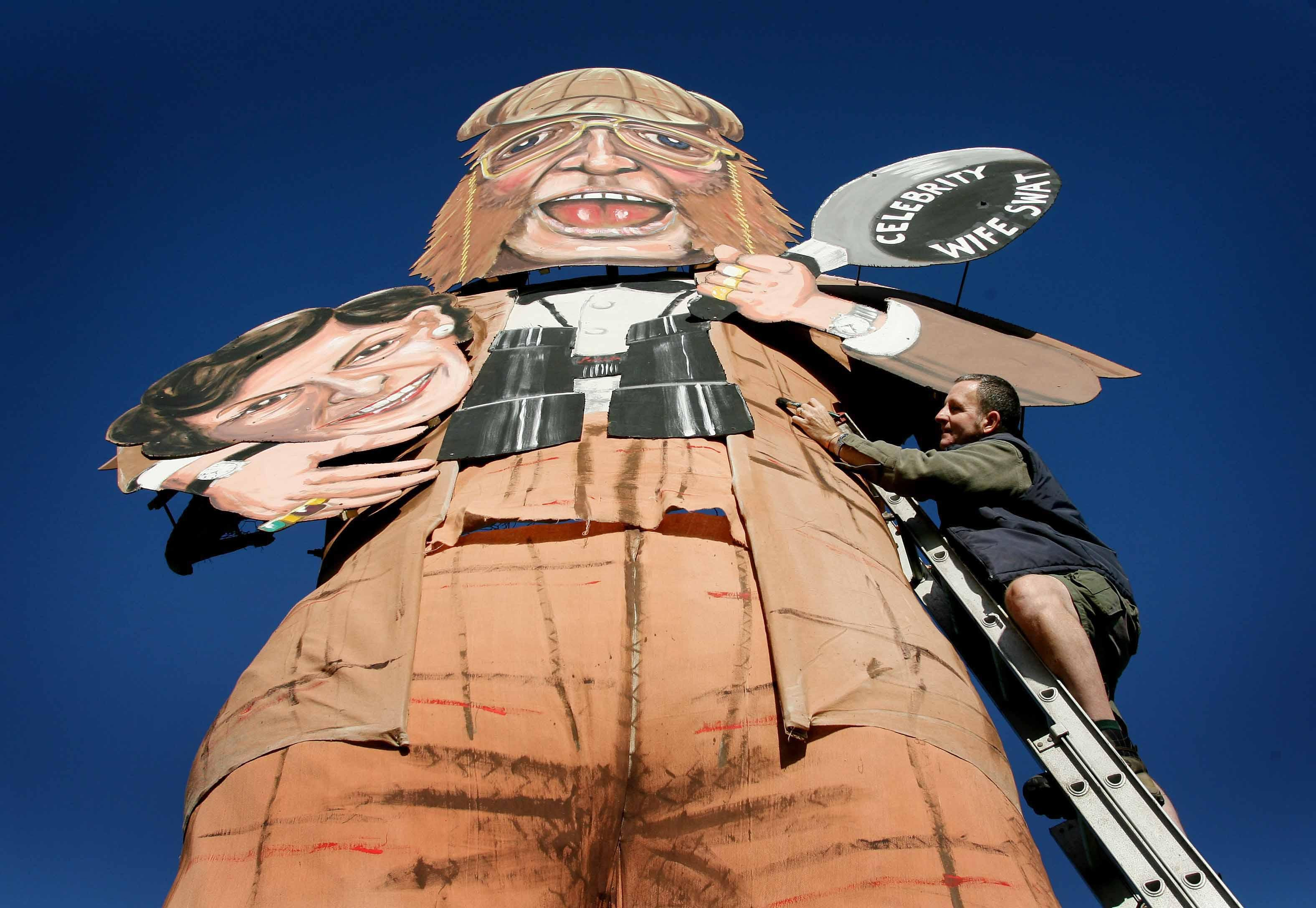 Barry Stableford of the Edenbridge Bonfire Society in Kent puts the final touches to their celebrity guy, racing tipster John McCririck and former Tory minister Edwina Currie, in 2006