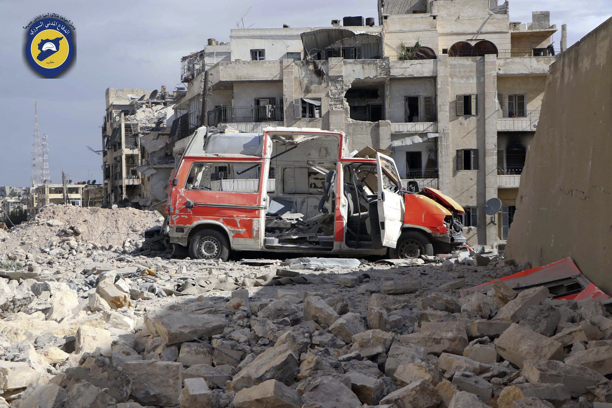 A destroyed ambulance is seen outside the Syrian Civil Defence main centre after air strikes in Ansari neighbourhood in Aleppo