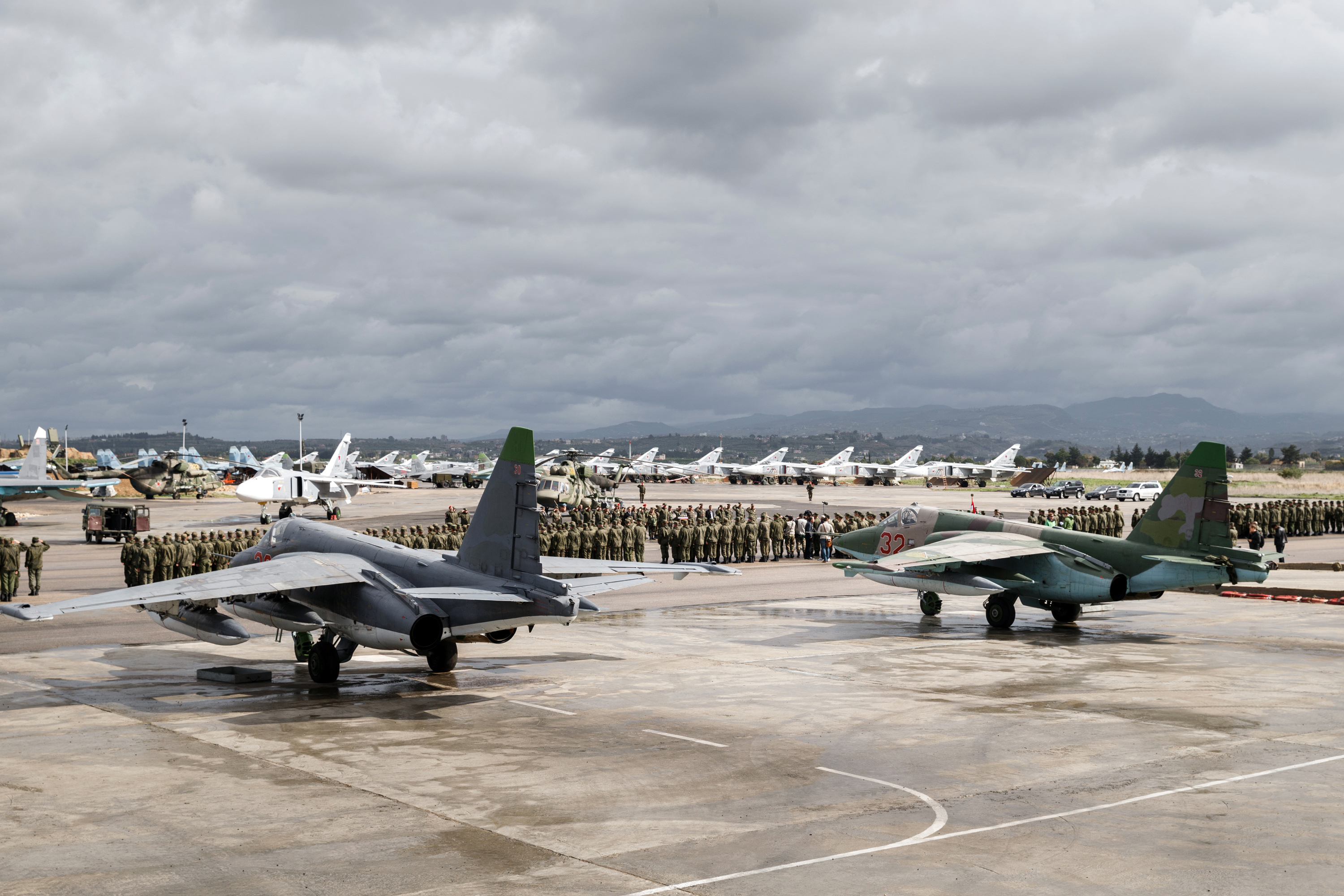 A lineup of Russian troops is held before withdrawal at Hemeimeem air base in Syria