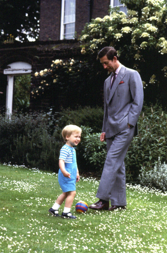 William and the Prince of Wales playing in the garden of Kensington Palace in 1984 (PA)