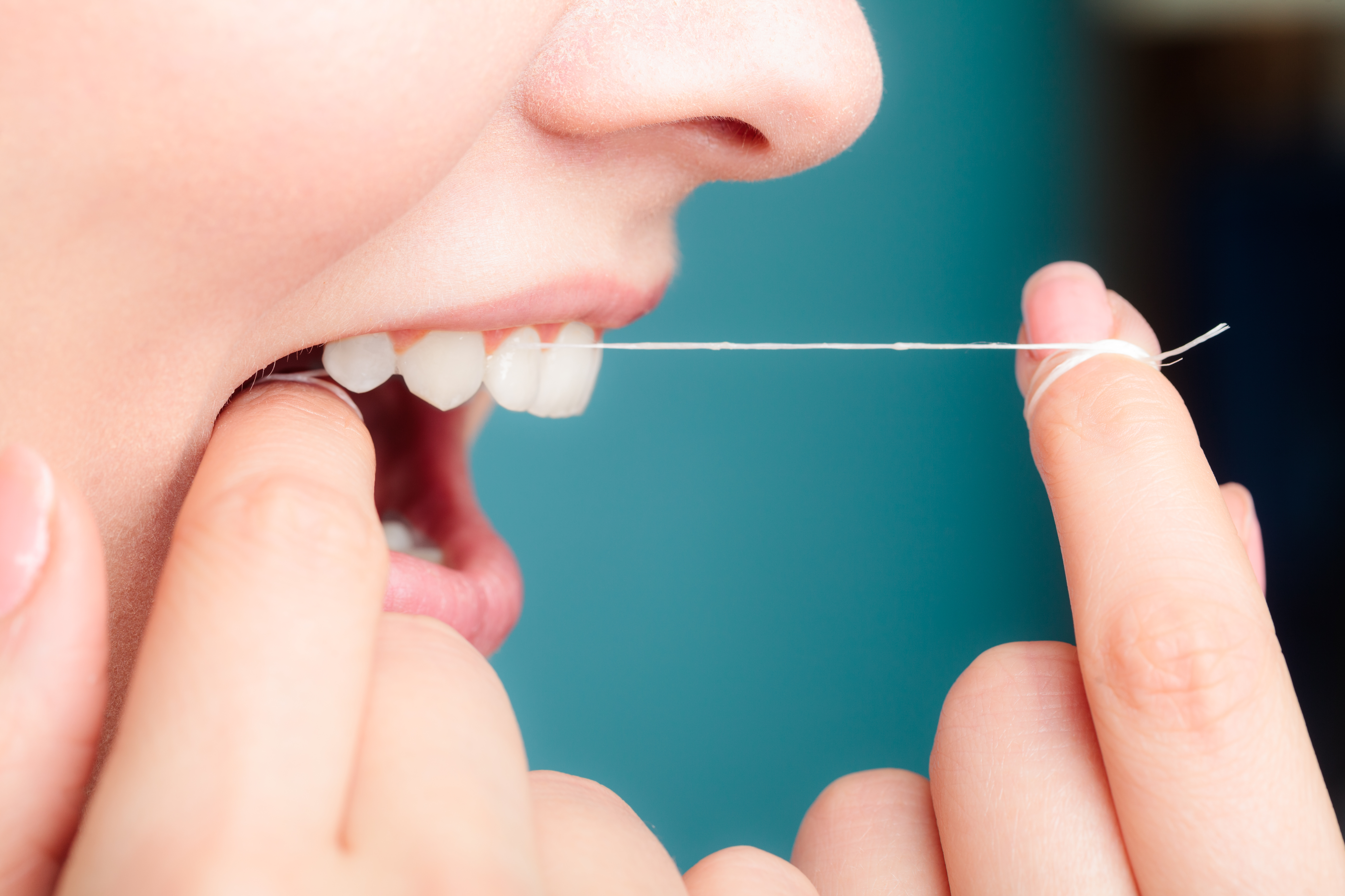 A woman flossing