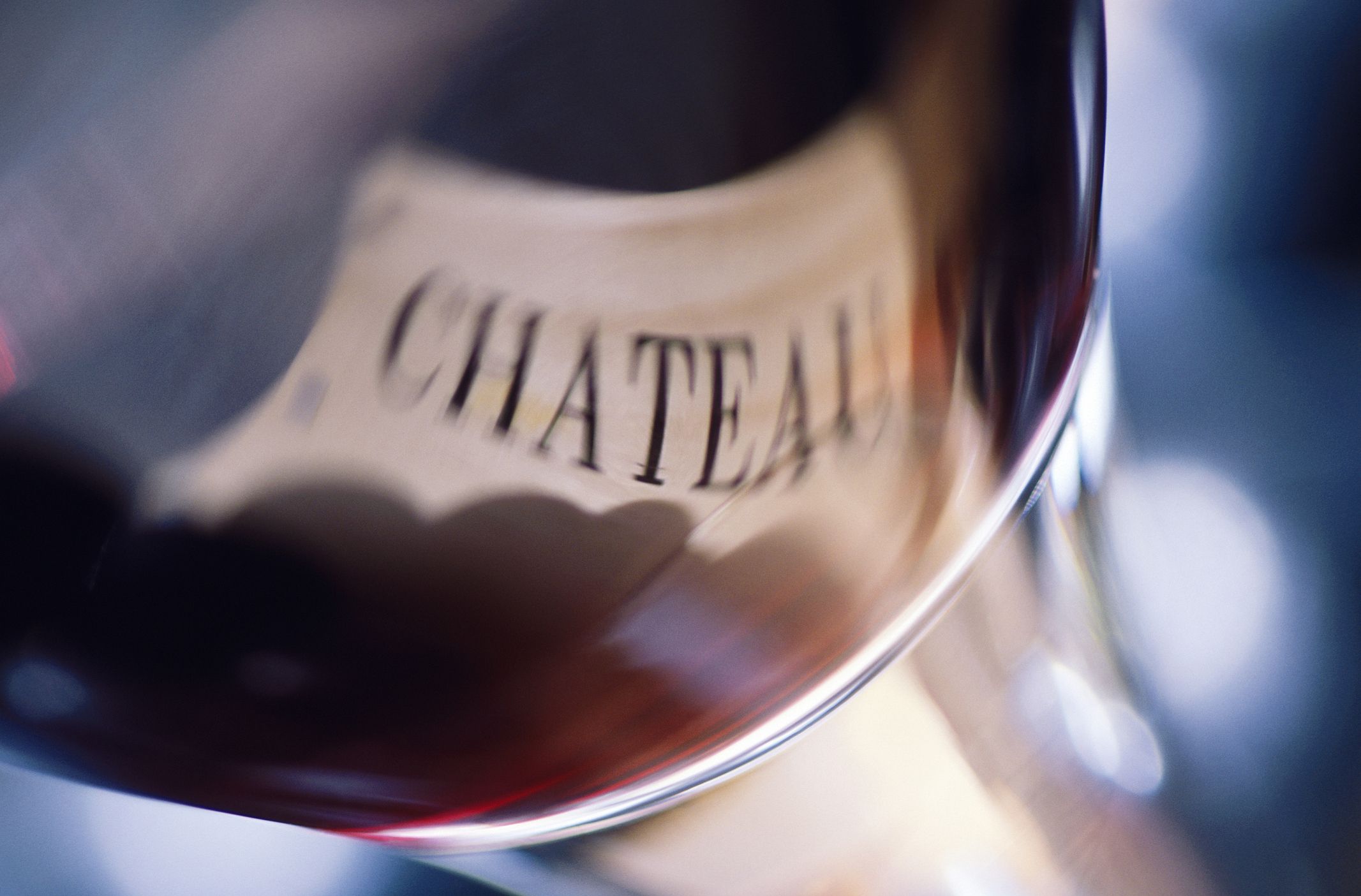 French wine label with grapes reflected in glass