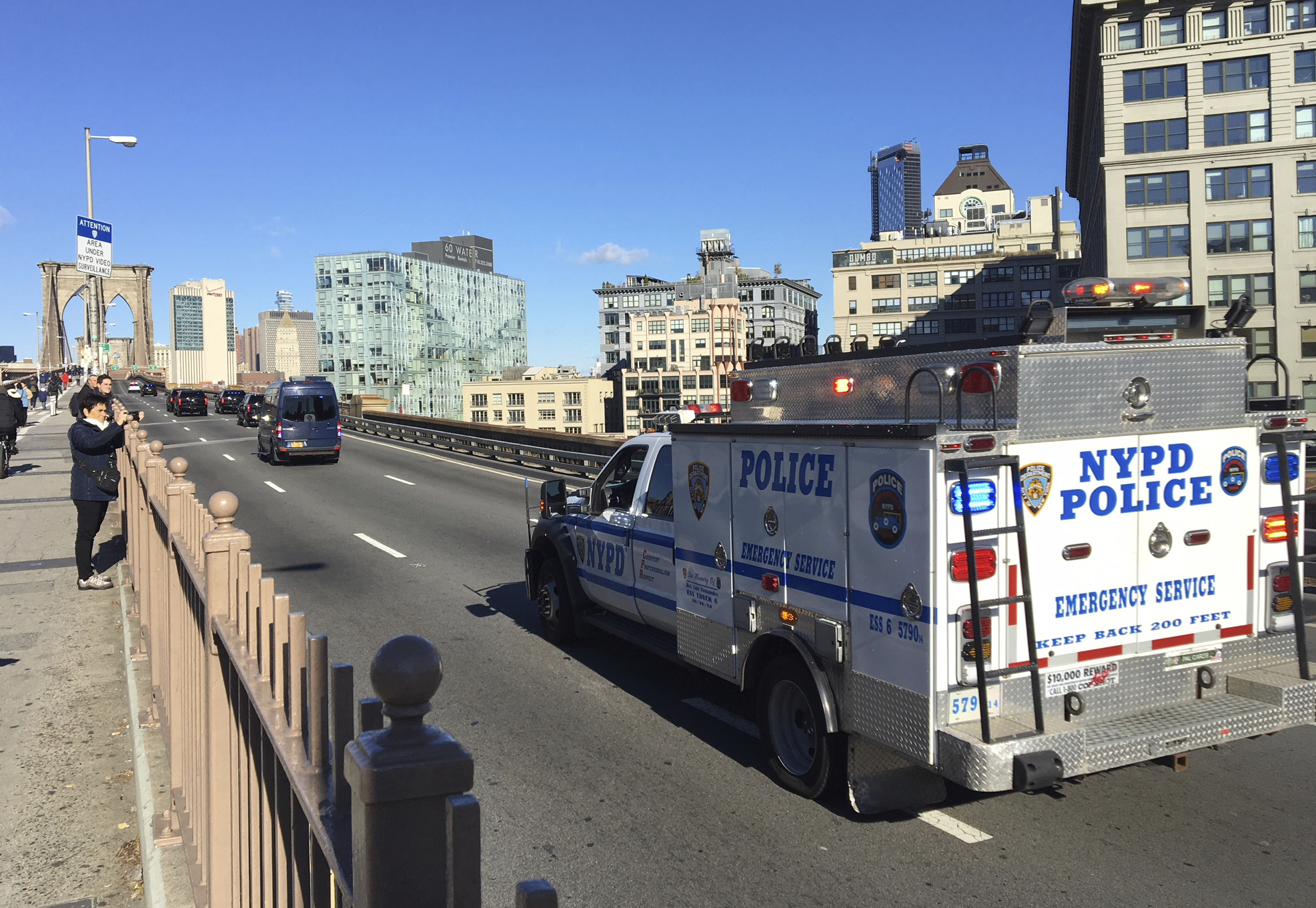 An NYPD emergency service vehicle brings up the rear of a heavily armed federal law enforcement caravan carrying notorious Mexican drug lord Joaquin 'El Chapo' Guzman