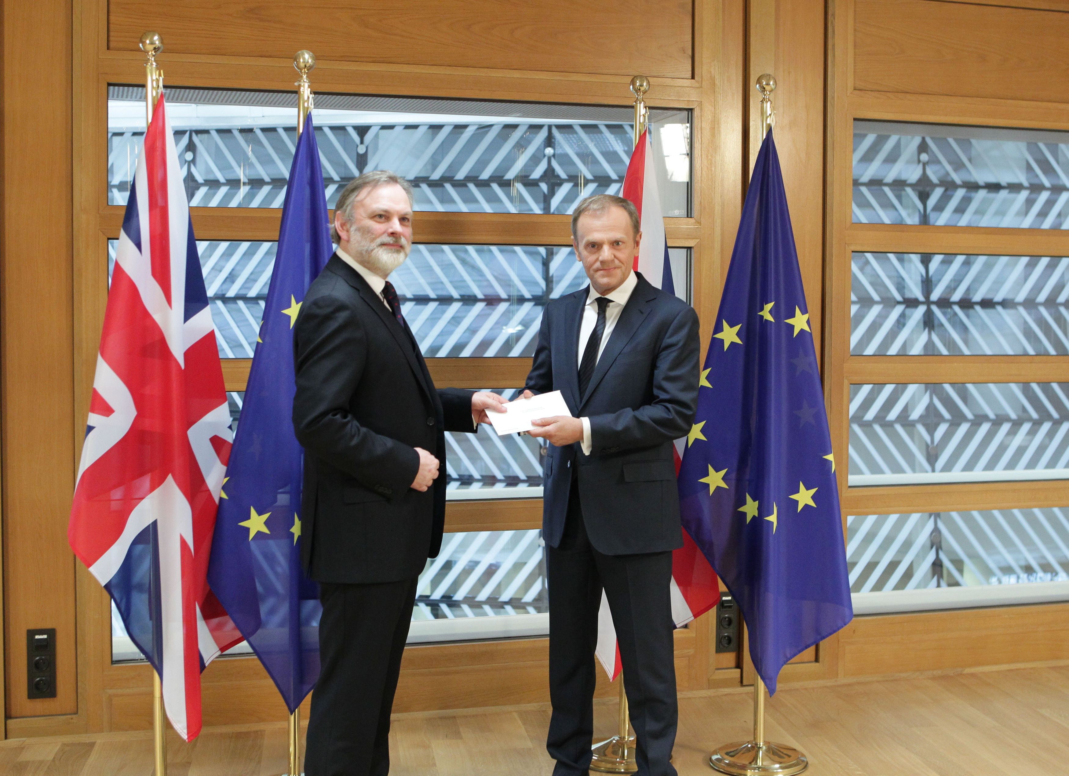 Britain's Ambassador to the EU, Sir Tim Barrow, hand delivers Theresa May's Brexit letter in notice of the UK's intention to leave the bloc (