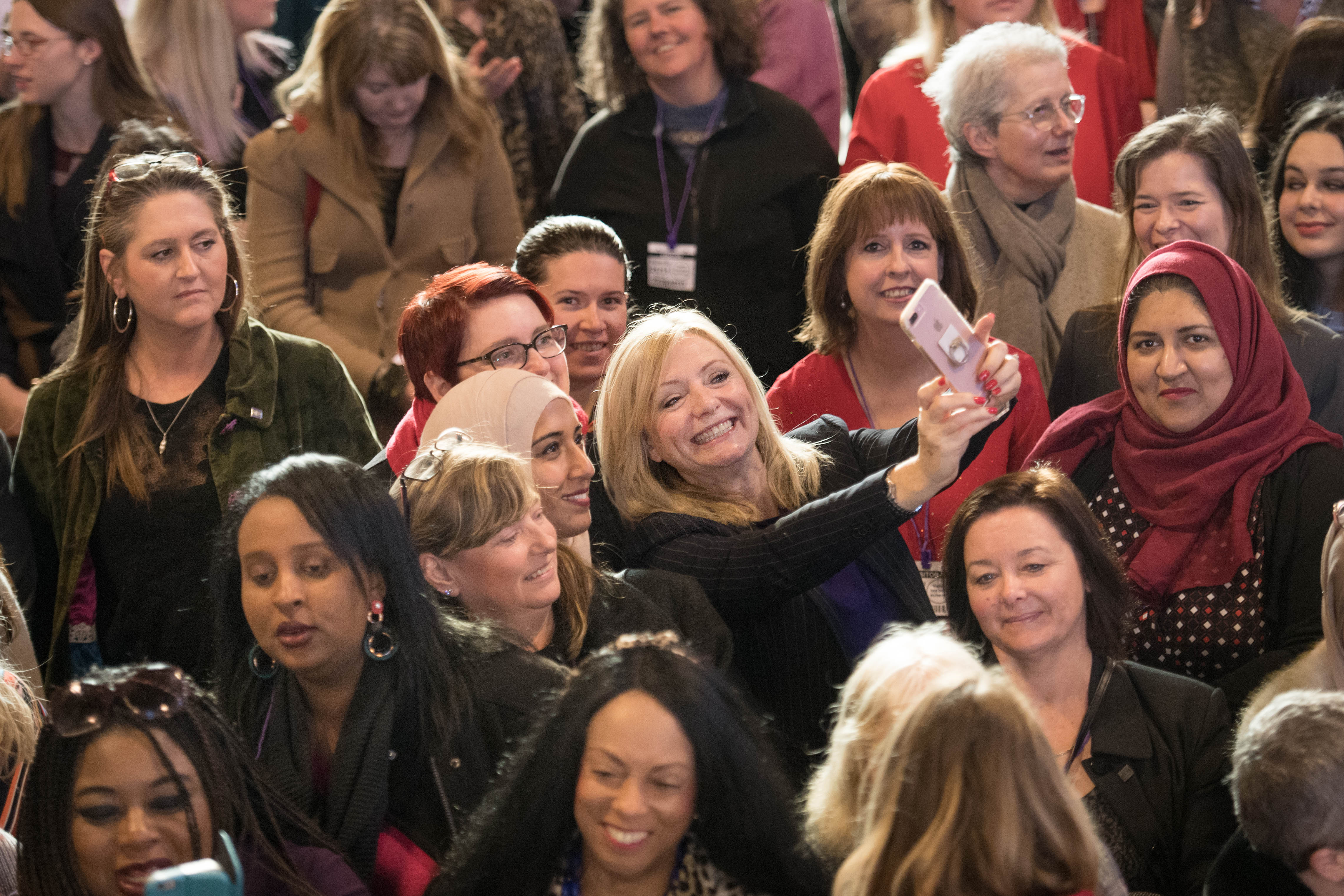 Labour MP Tracy Brabin takes a selfie as MPs from across the political spectrum gather alongside aspiring woman from their constituencies to show them the inner workings of Westminster.
