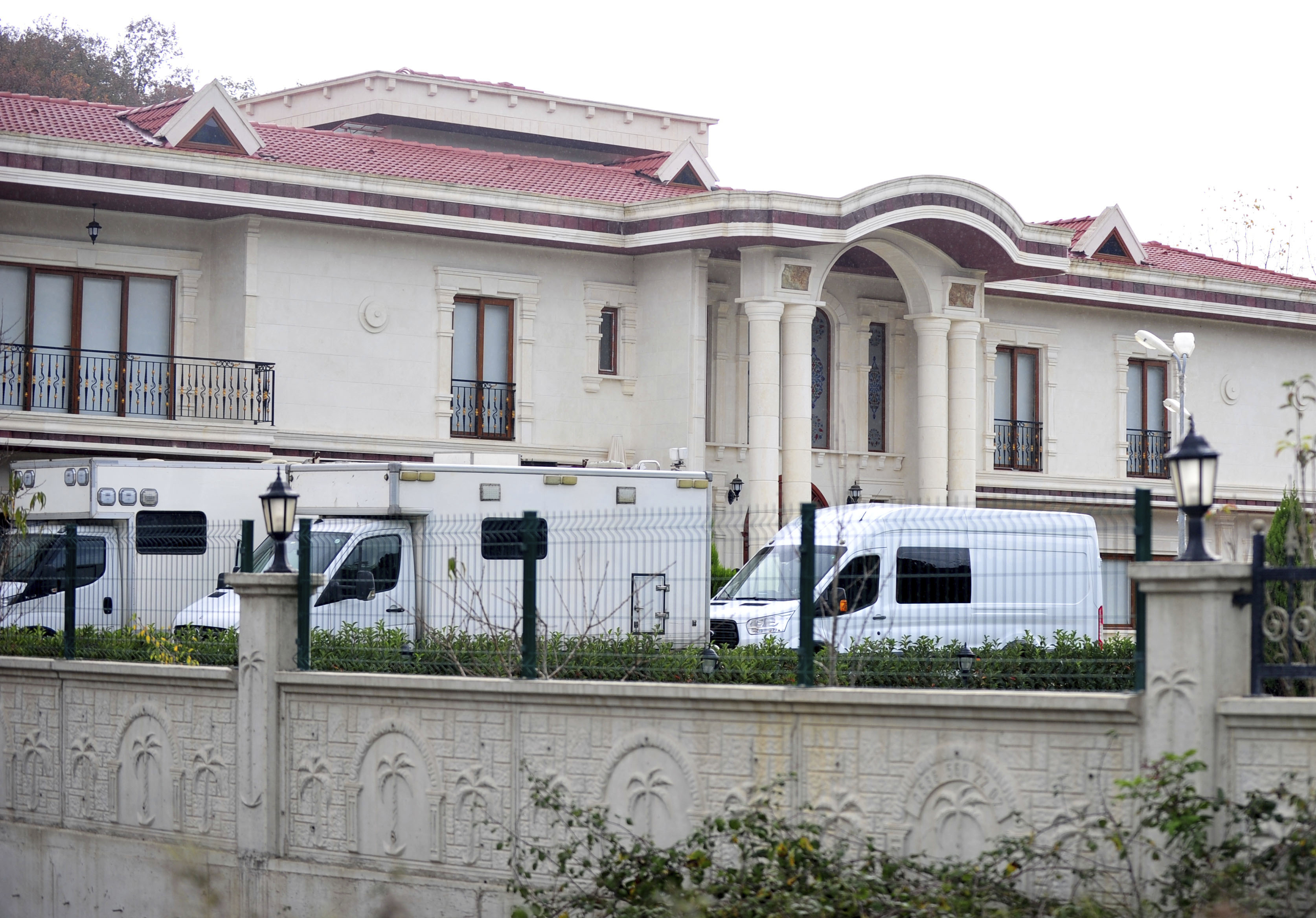 Turkish police cars seen parked as they search two adjoining villas in Yalova