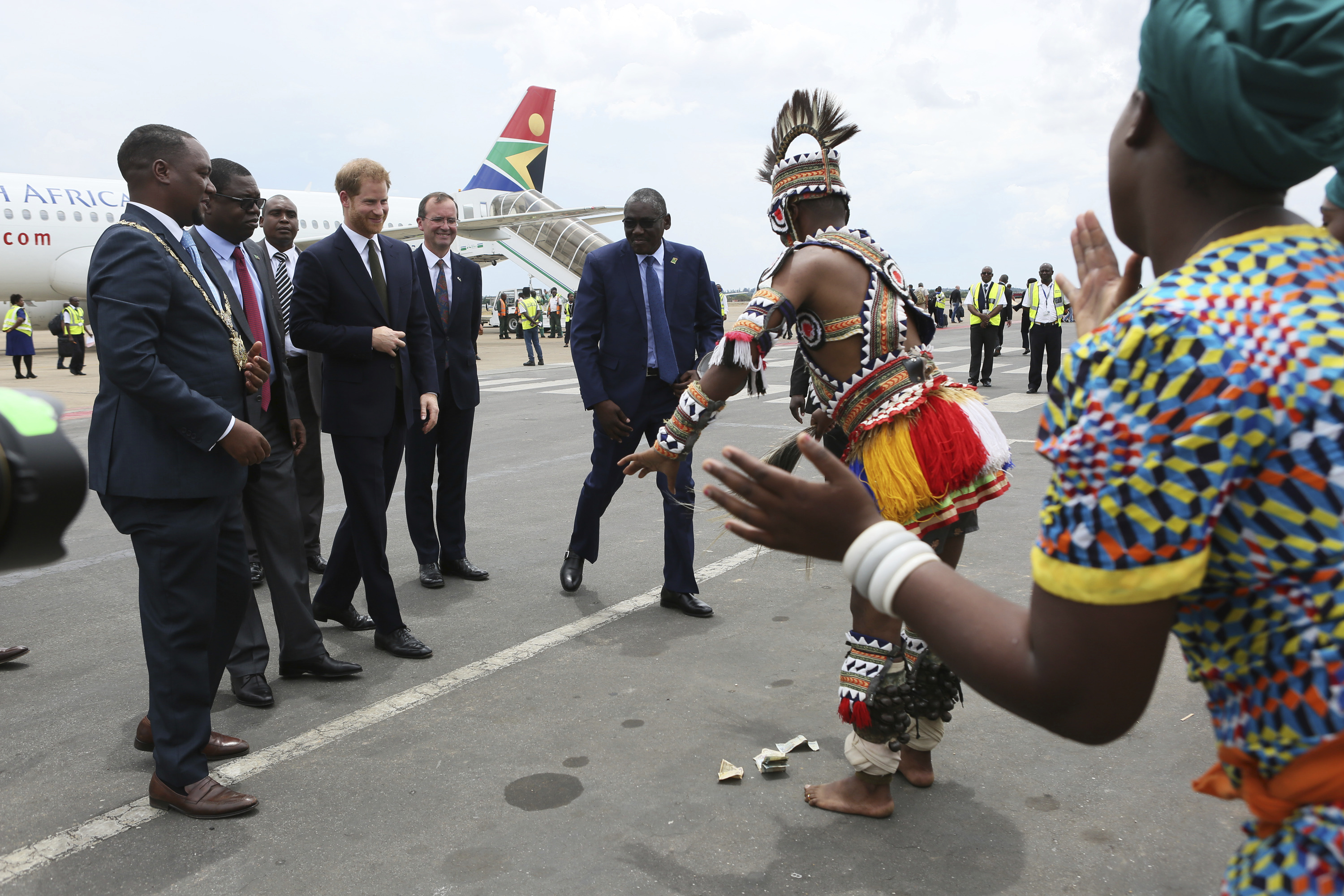 Zambian traditional dancers perform for the Duke of Sussex upon his arrival at Kenneth Kaunda airport in Lusaka