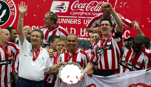 Warnock, front left, won promotion to the Premier League with hometown club Sheffield United in 2006