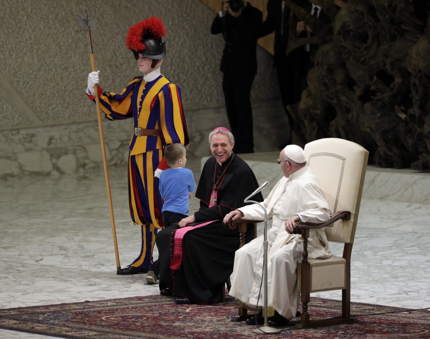 Child runs onstage to play during pope's address to Vatican audience