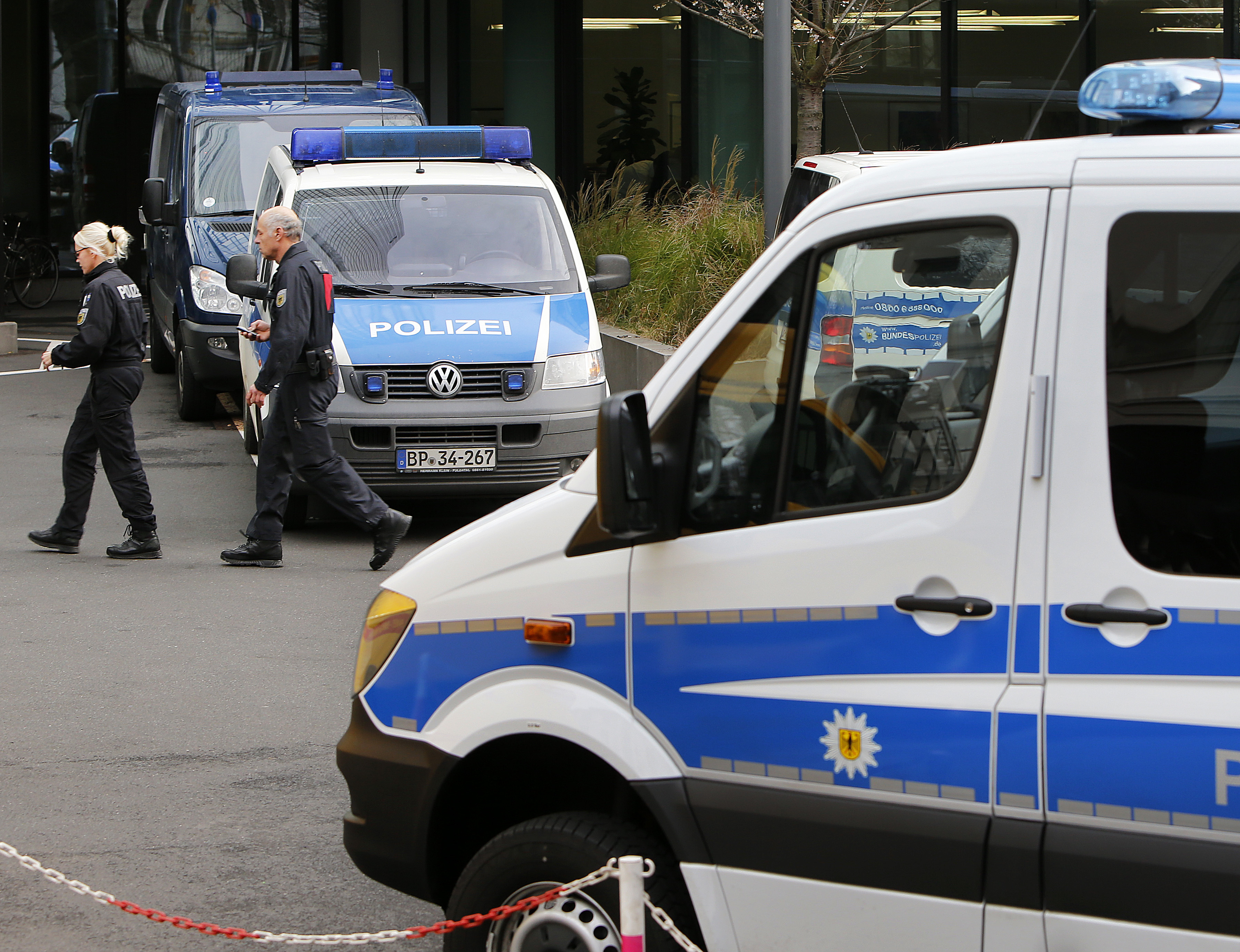 Police officers at Deutsche Bank headquarters during a raid in Frankfurt