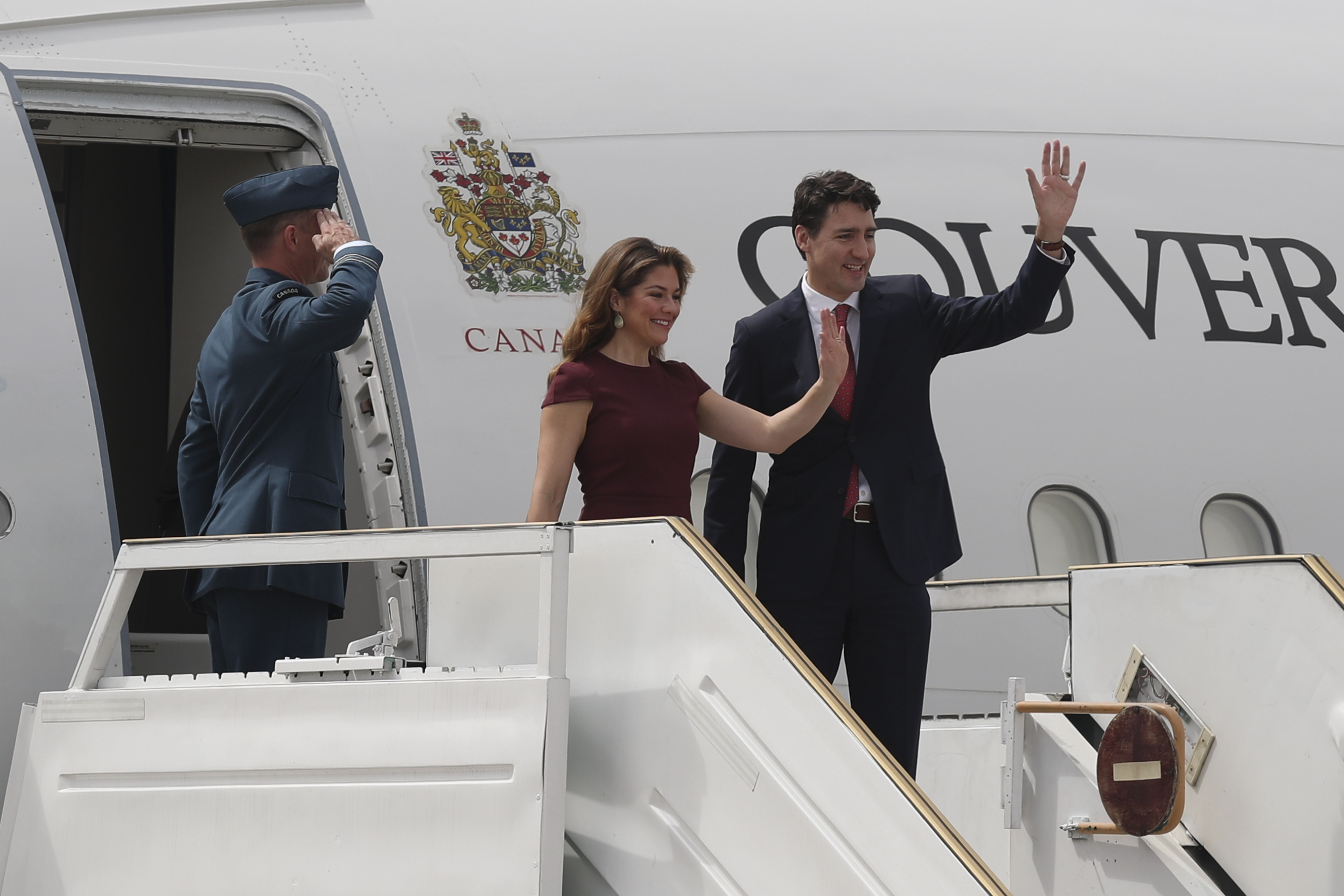 Canada's Prime Minister Justin Trudeau and first lady Sophie Gregoire wave on their arrival for the G20 Summit in Buenos Aires 