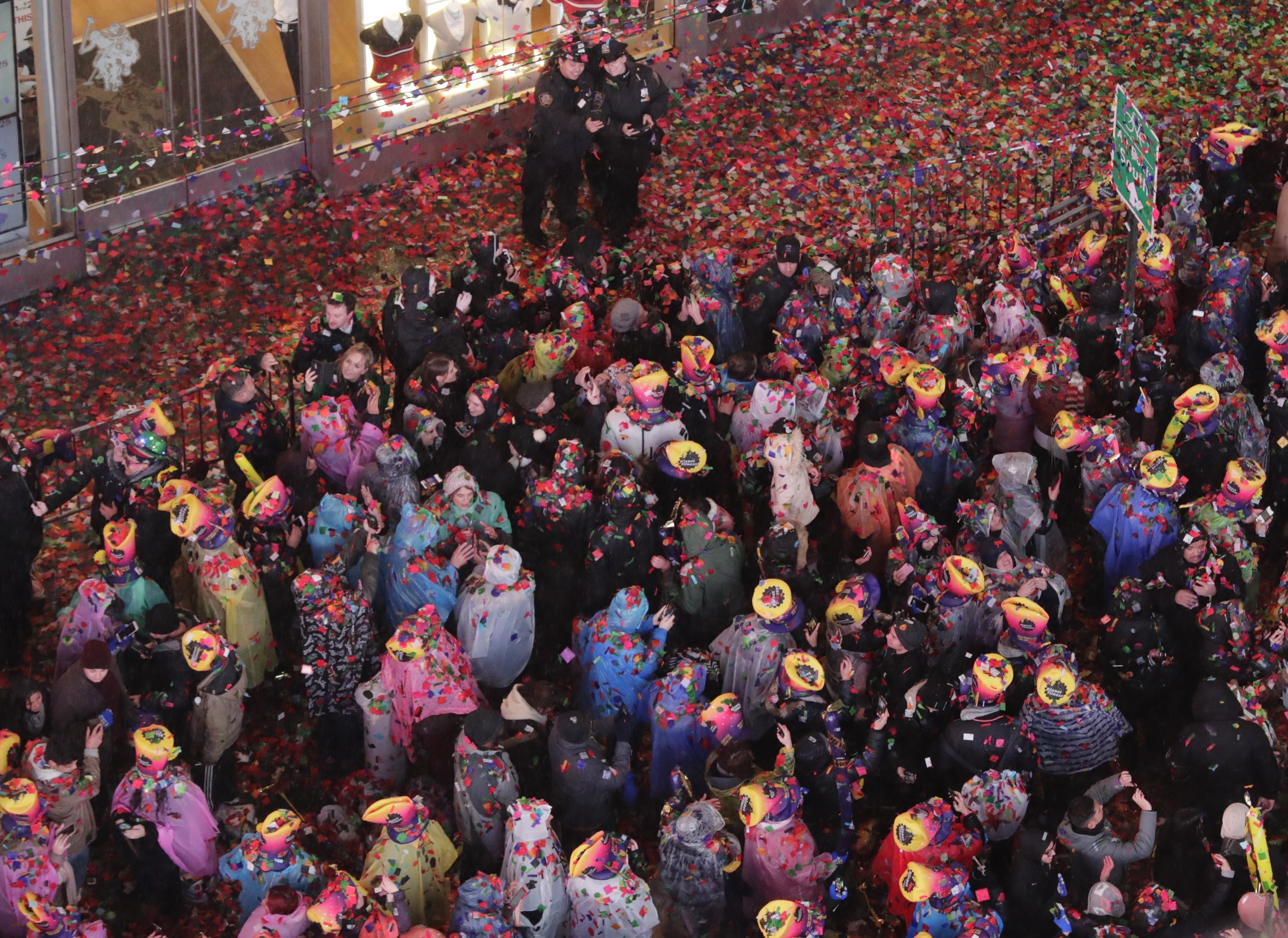 Confetti covers the crowd during the New Year's celebration in Times Square, New York 