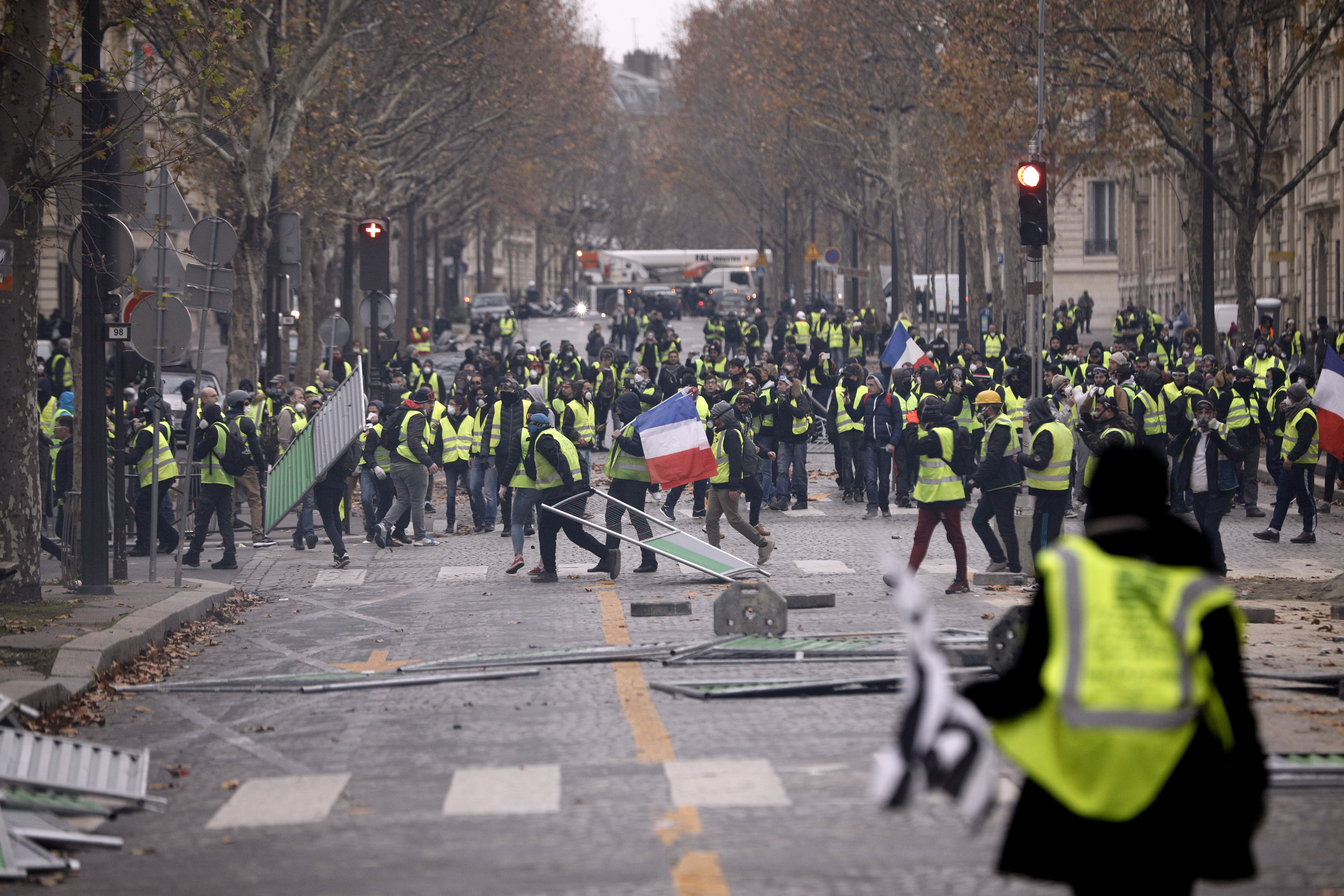 Demonstrators build a barricade near the Champs-Elysees during a demonstration