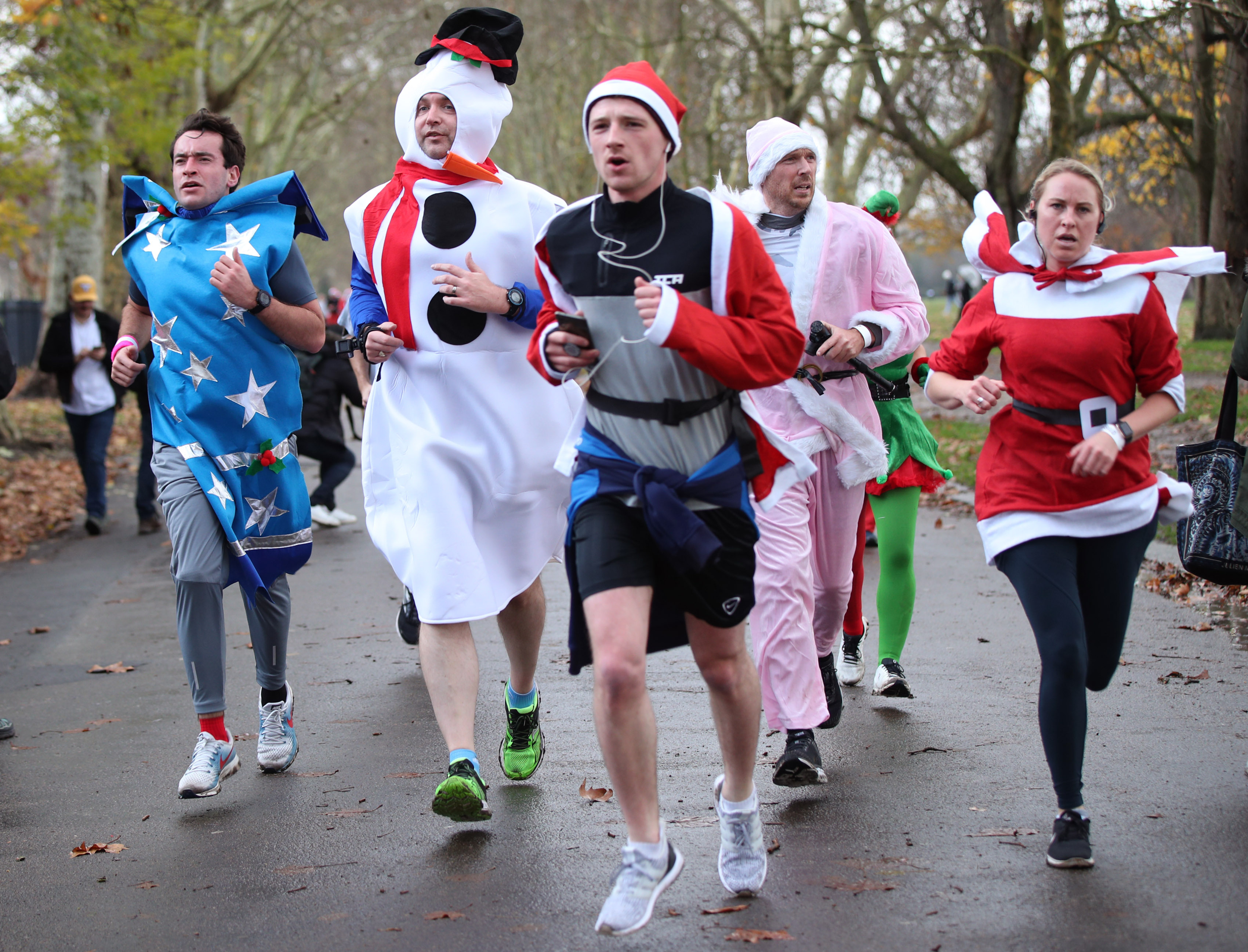 Participants taking part in the London Santa Run in Victoria Park, east London