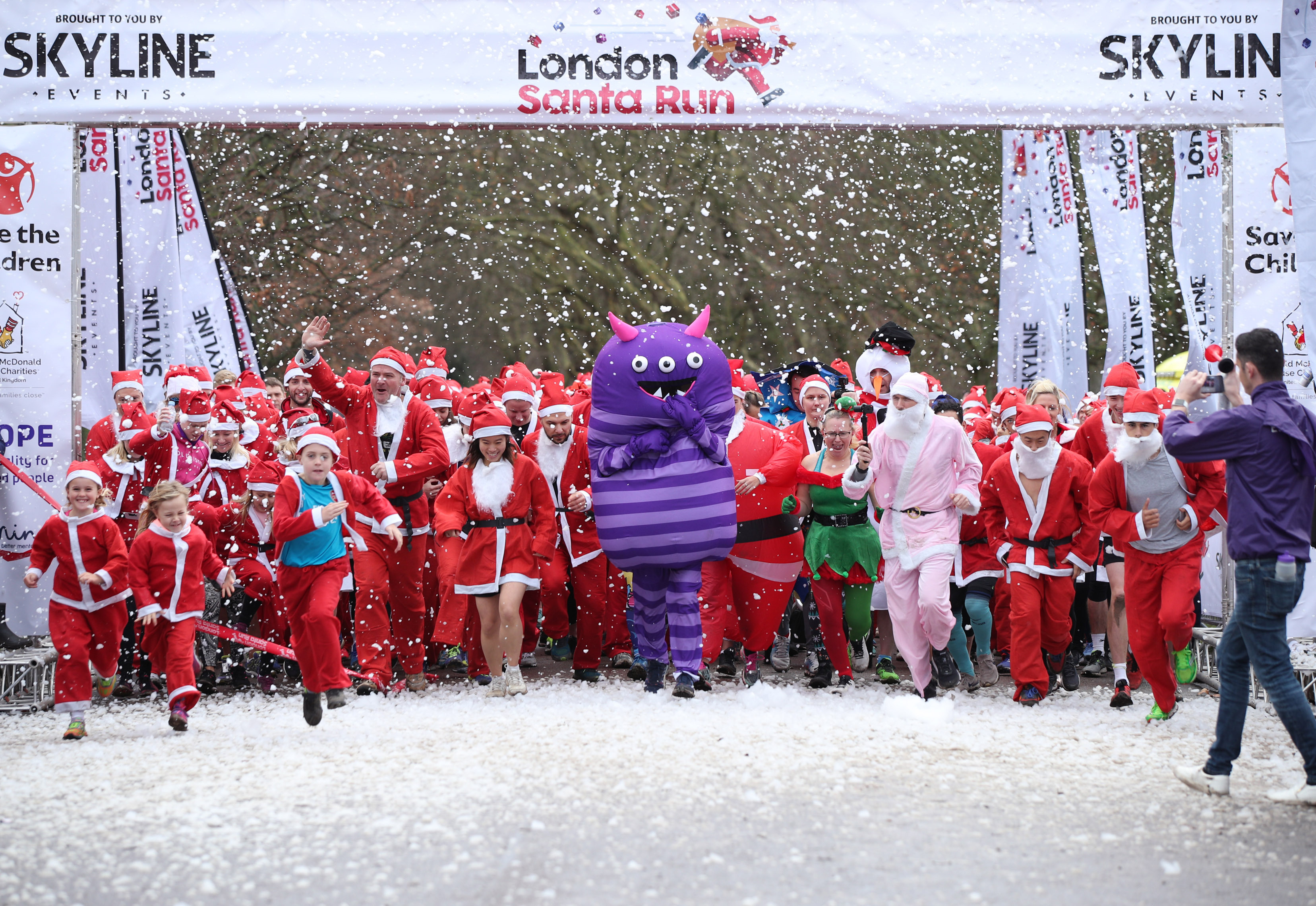 Participants taking part in the London Santa Run in Victoria Park, east London