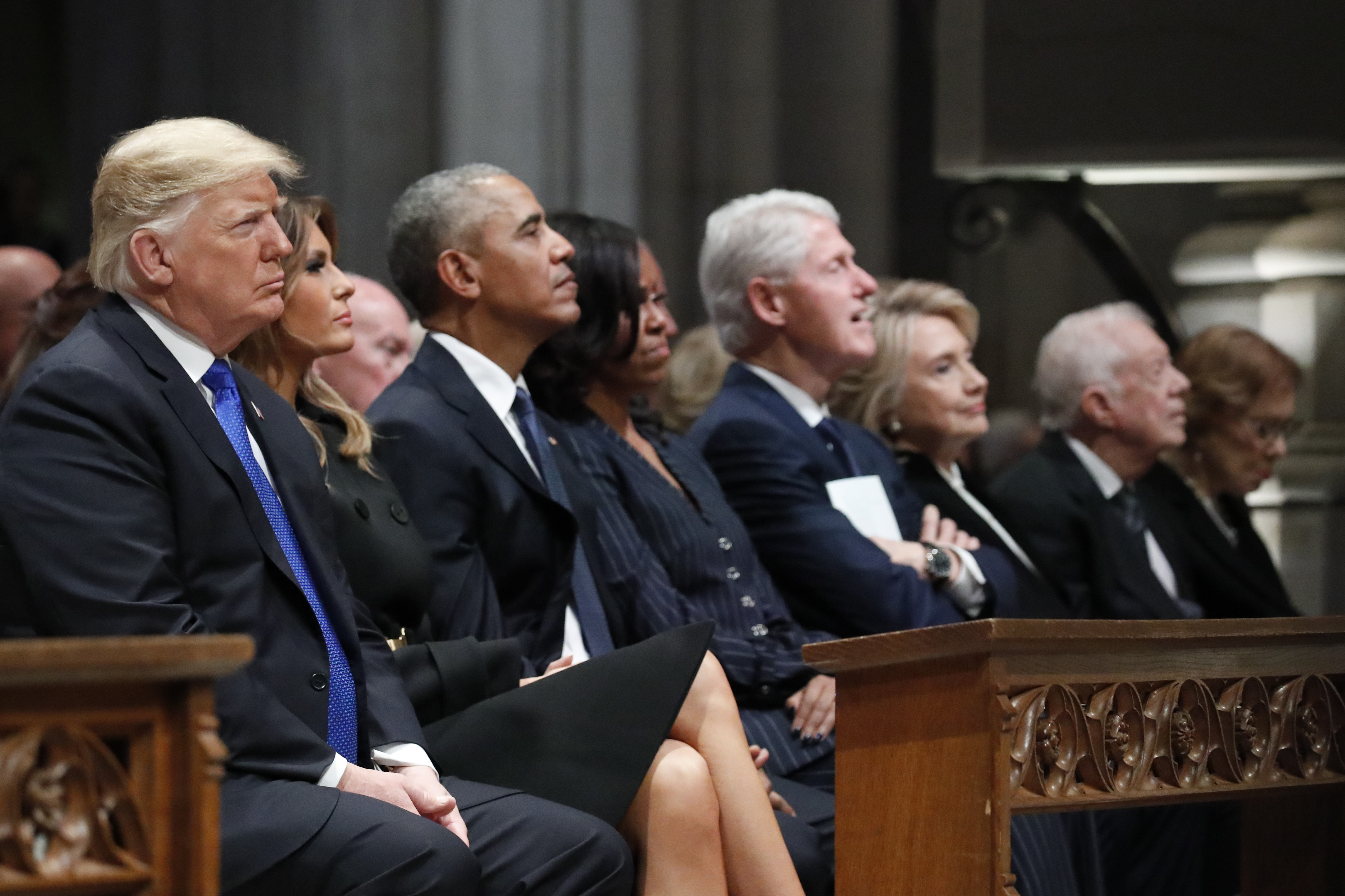 President Donald Trump, first lady Melania Trump, former president Barack Obama, Michelle Obama, former president Bill Clinton, former secretary of state Hillary Clinton, and former president Jimmy Carter listen as former president George W Bush speaks during a state funeral for former president George HW Bush