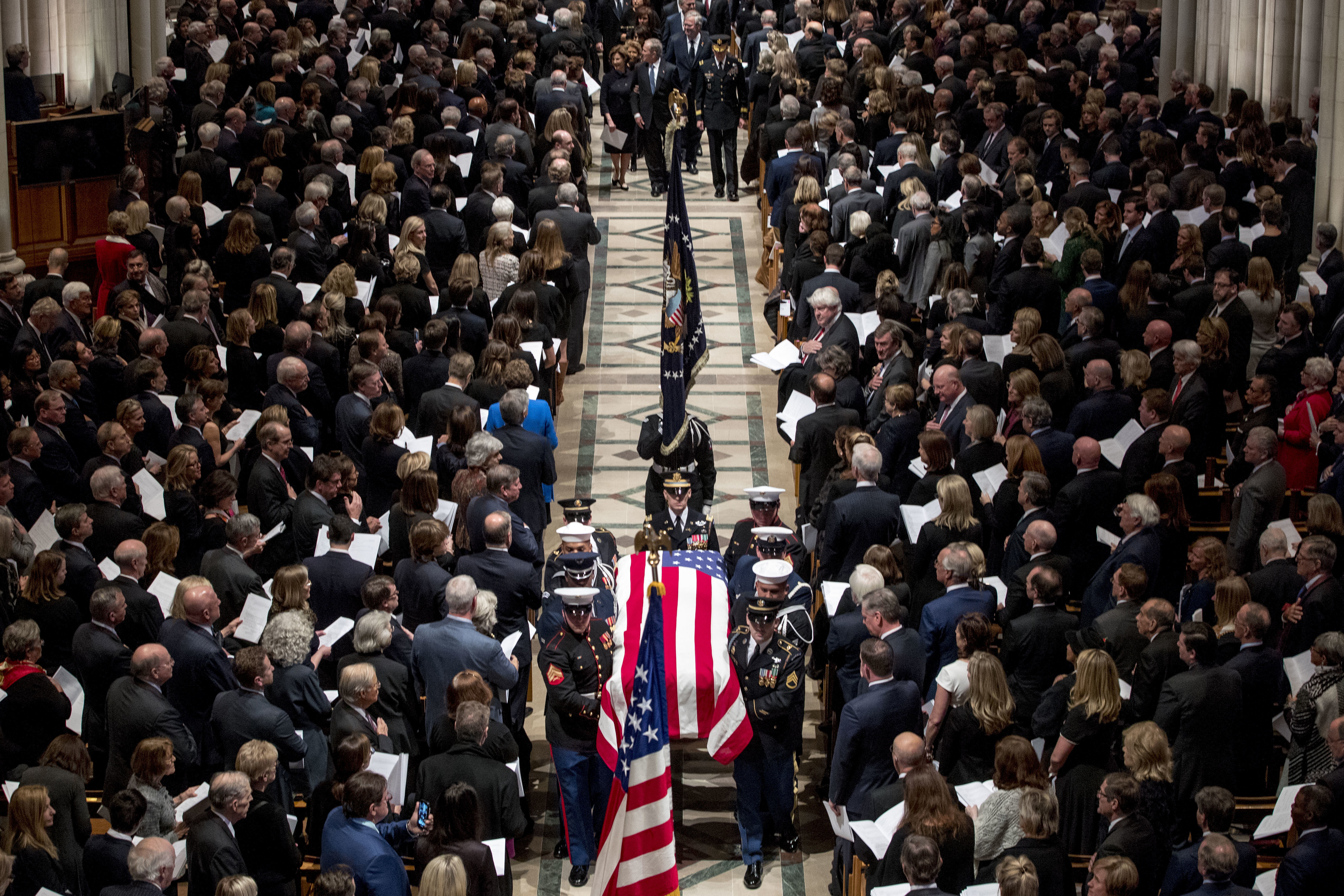 The flag-draped coffin of former president George HW Bush 