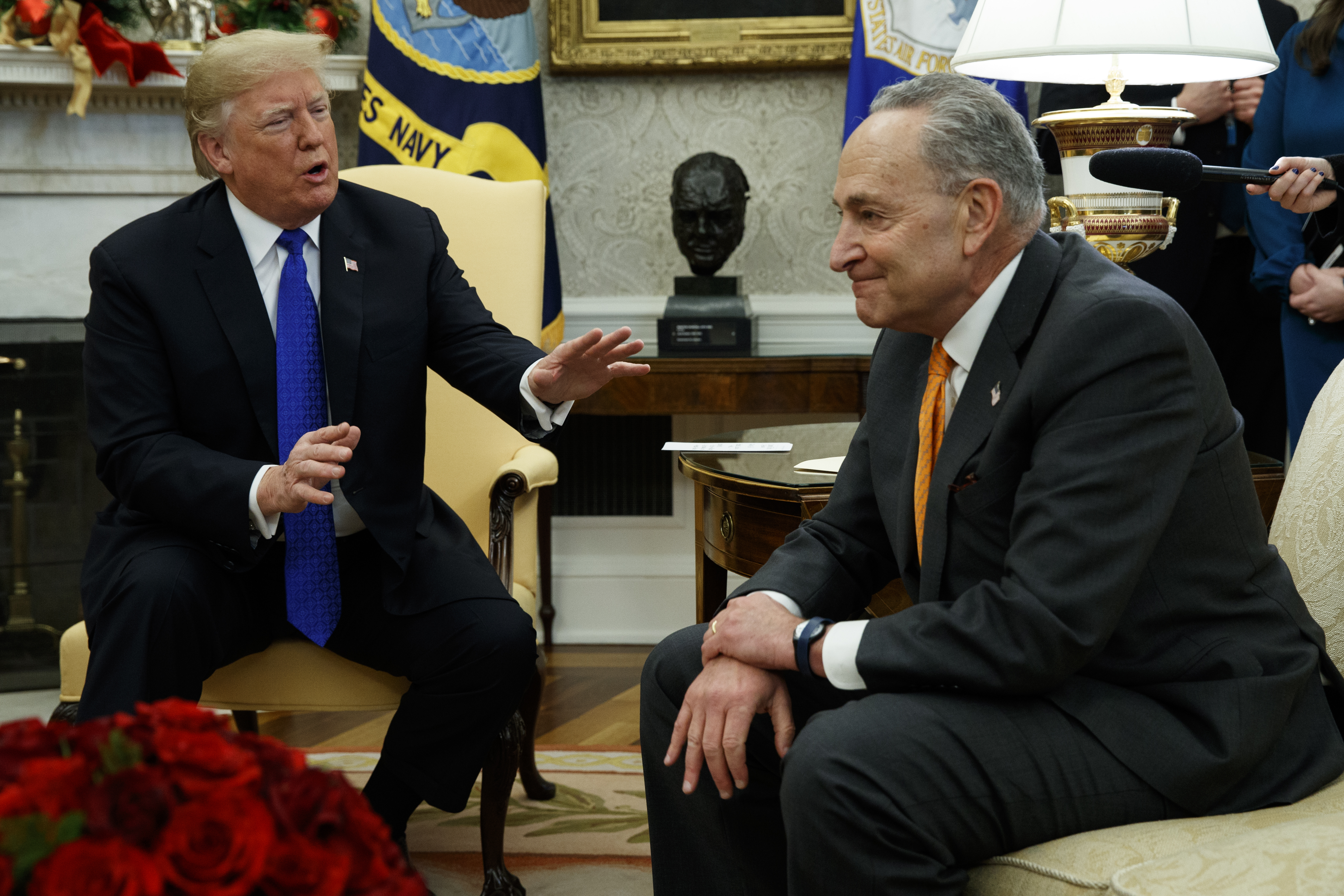 President Donald Trump speaks to Senate Minority Leader Chuck Schumer, D-N.Y., during a meeting with Democratic leadership in the Oval Office of the White House