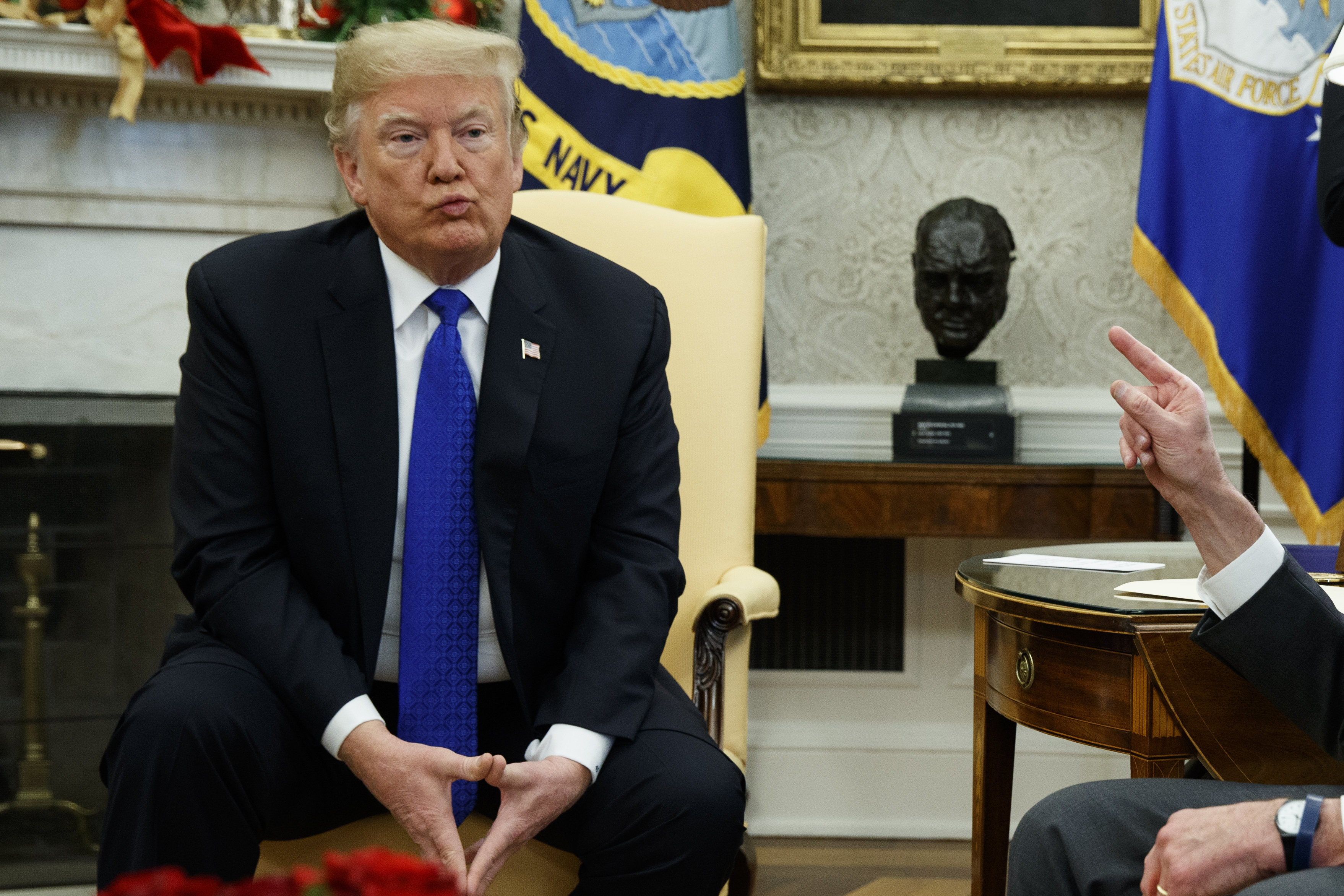 President Donald Trump listens during a meeting with Senate Minority Leader Chuck Schumer, D-N.Y., and House Minority Leader Rep. Nancy Pelosi, D-Calif., in the Oval Office of the White House
