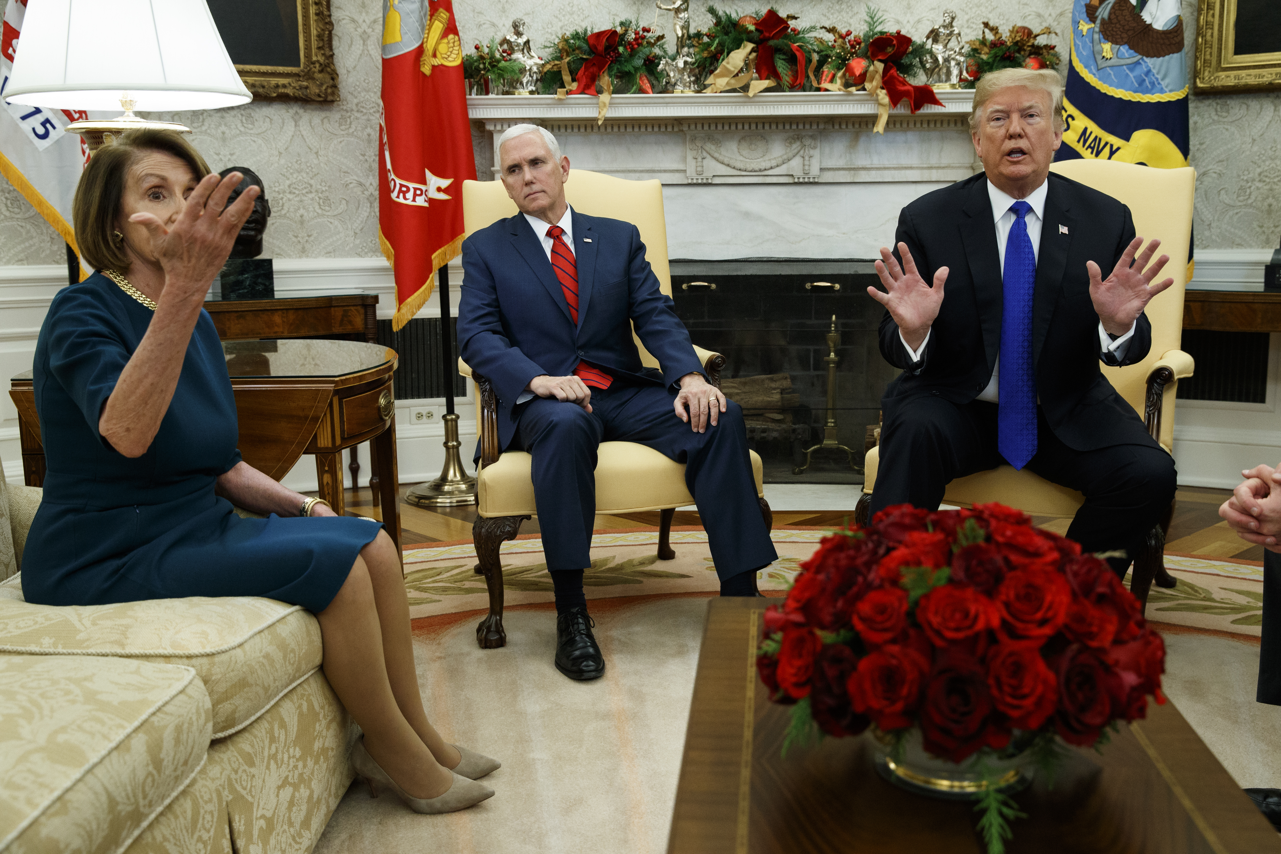 Vice President Mike Pence, center, listens as President Donald Trump argues with House Minority Leader Rep. Nancy Pelosi, D-Calif., during a meeting in the Oval Office of the White House