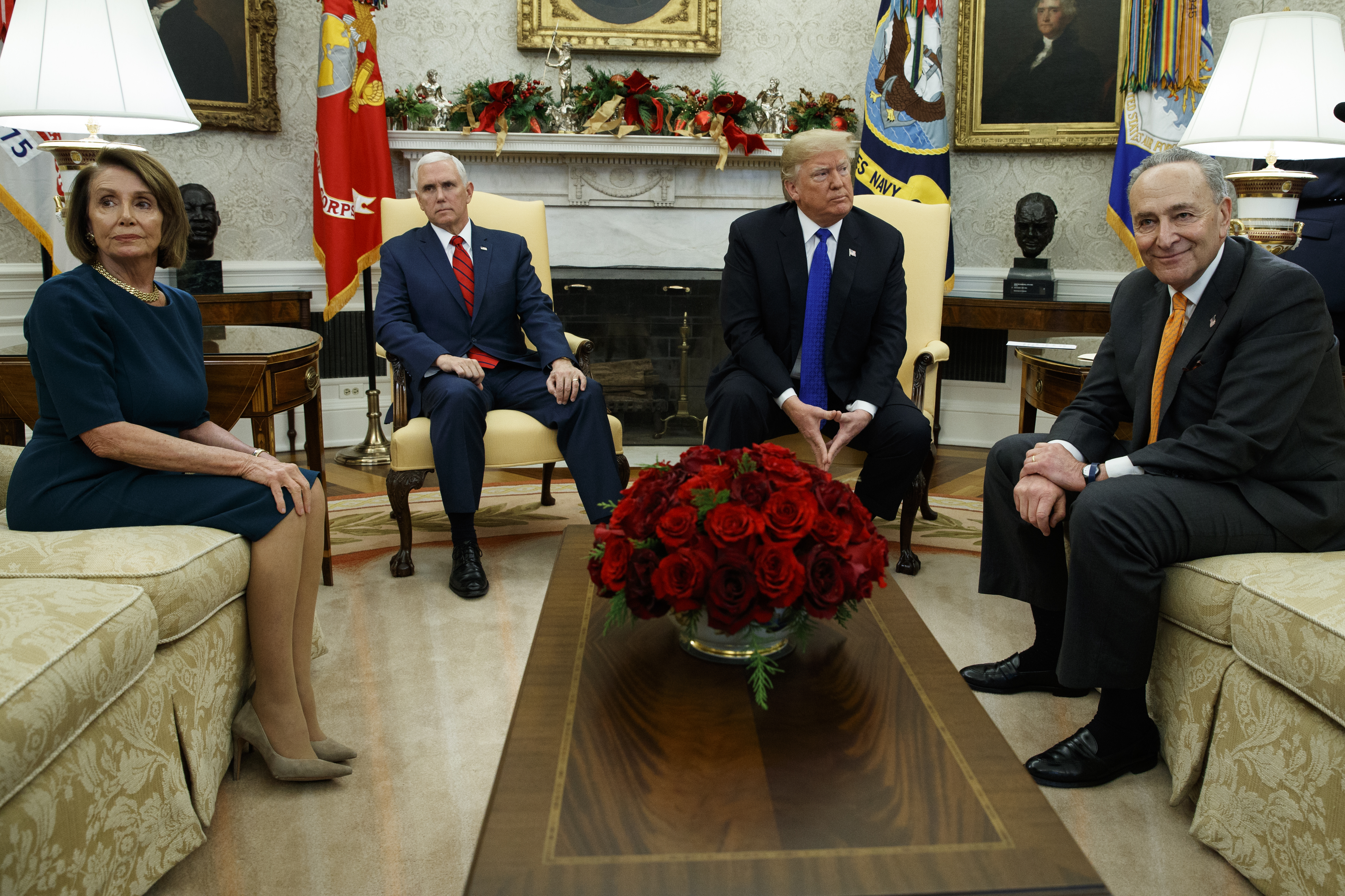 House Minority Leader Rep. Nancy Pelosi, D-Calif., Vice President Mike Pence, President Donald Trump, and Senate Minority Leader Chuck Schumer, D-N.Y., wait as media leave a meeting in the Oval Office of the White House