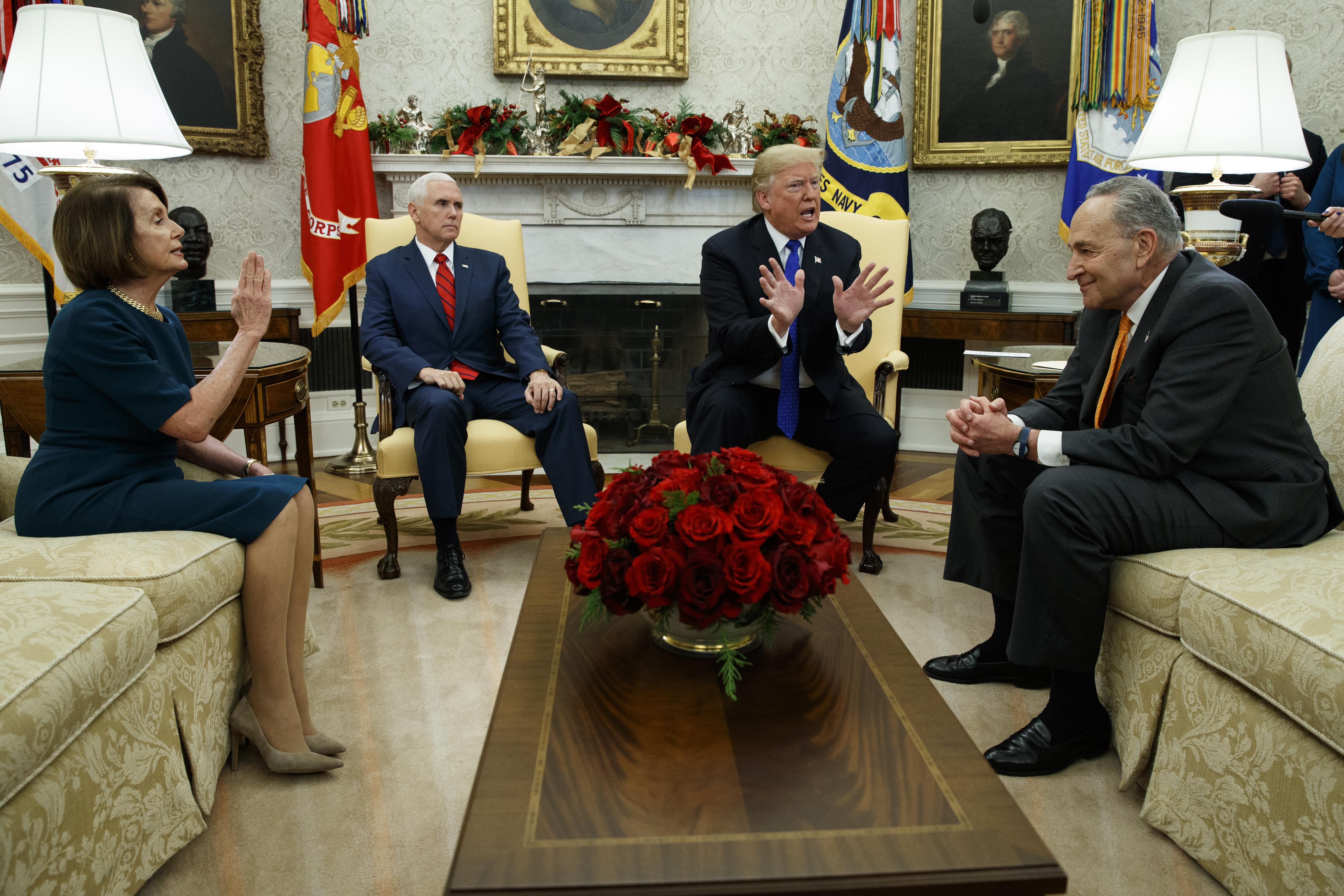 House Minority Leader Rep. Nancy Pelosi, D-Calif., Vice President Mike Pence, President Donald Trump, and Senate Minority Leader Chuck Schumer, D-N.Y., argue during a meeting in the Oval Office of the White House