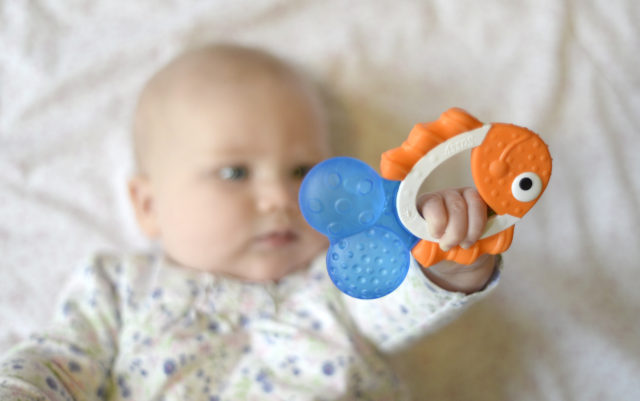 Baby with teething ring